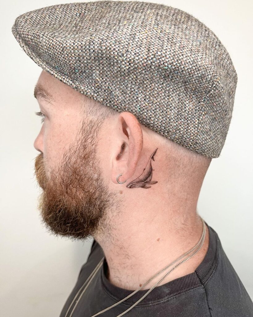 Small Dope Whale Behind The Ear Tattoo