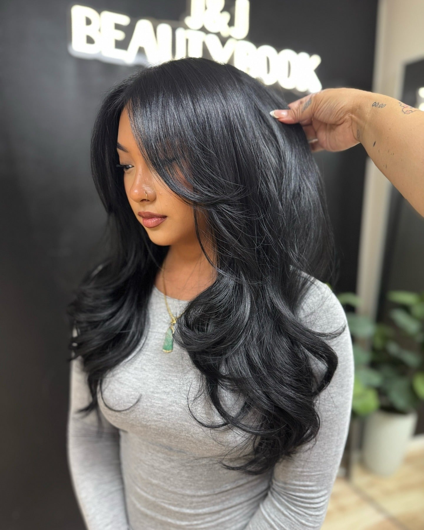 12. Jet Black Butterfly Cut with High Volume and Flicked Ends (Butterfly Haircut for Women)