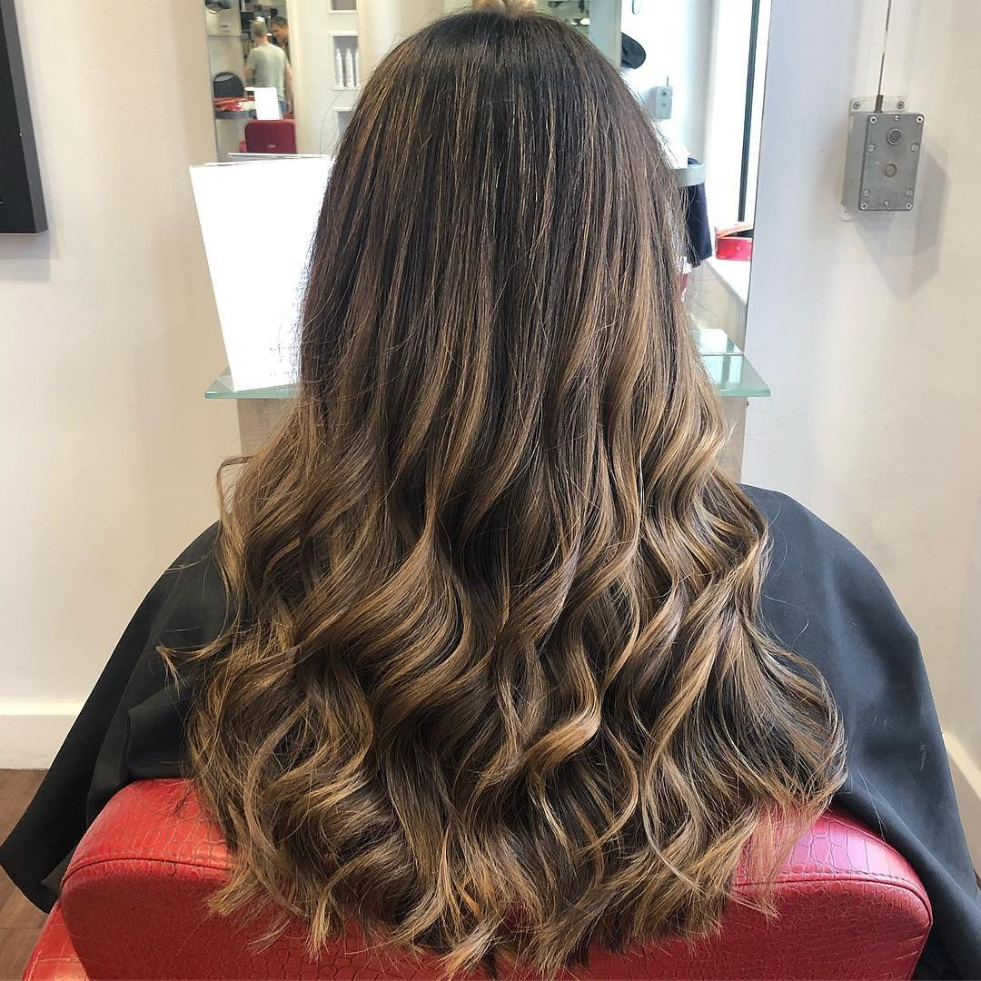 1. Long Wavy Caramel Brunette (Blonde Brown Hair Color)