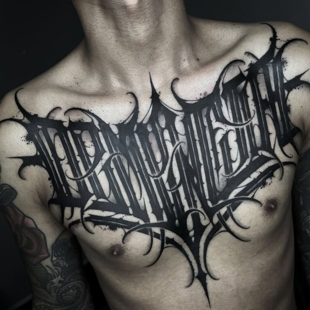 Bold Black Chest Tattoo Lettering
