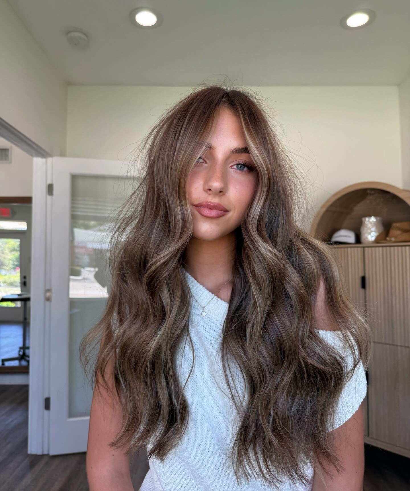 8. Toffee Balayage with Soft Volume Layers (Dark Blonde Hair Color with Highlights)