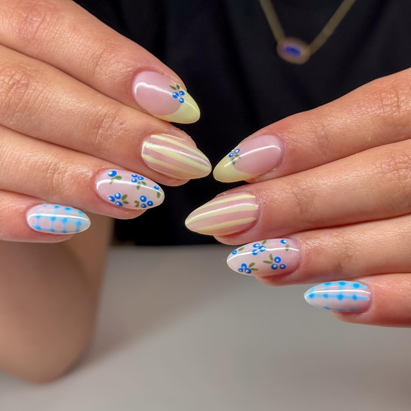 4. Pastel Yellow and Sky Blue Floral Mix (Winter Almond Nail Ideas)