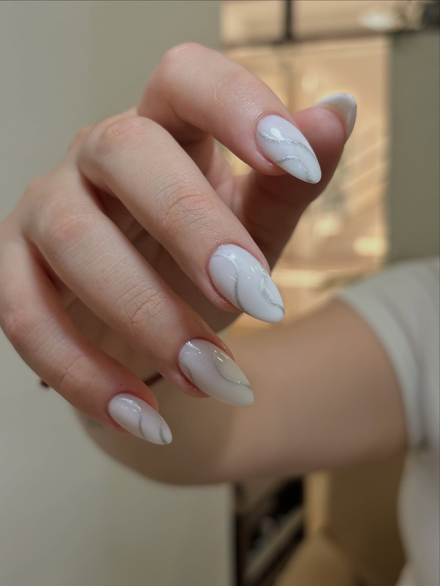 5. Milky White Swirl Elegance (Winter Almond Nail Ideas)