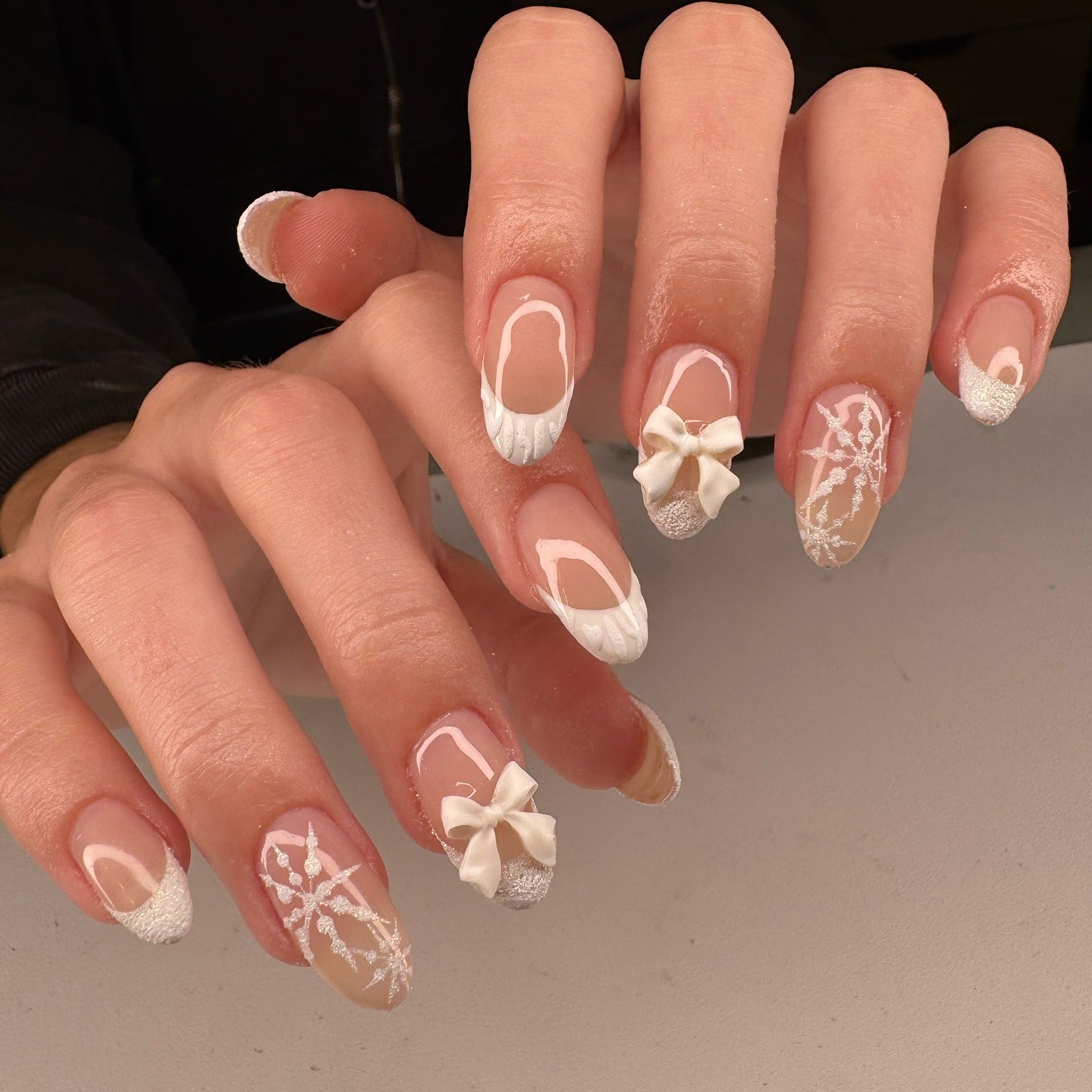 13. Snow White Bows and Sweater Texture (Winter Almond Nail Ideas)