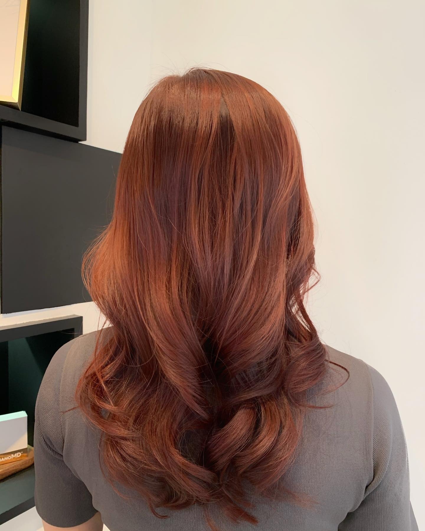 2. Medium Layers with Copper-Toned Auburn (Dark Auburn Hair Color)