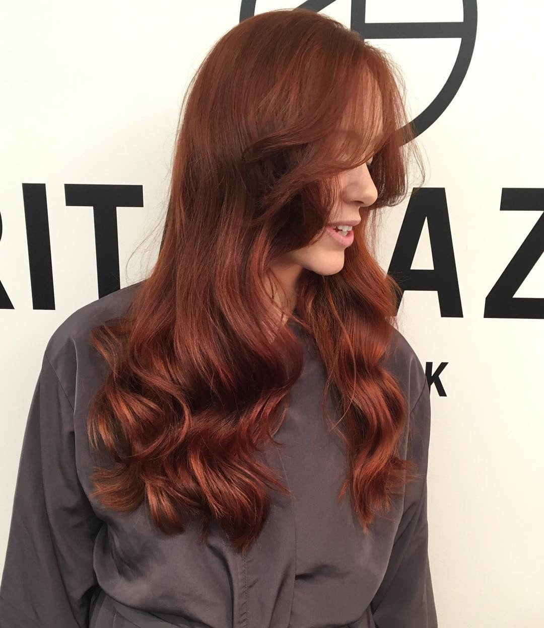 4. Glamorous Hollywood Waves in Warm Auburn (Dark Auburn Hair Color)