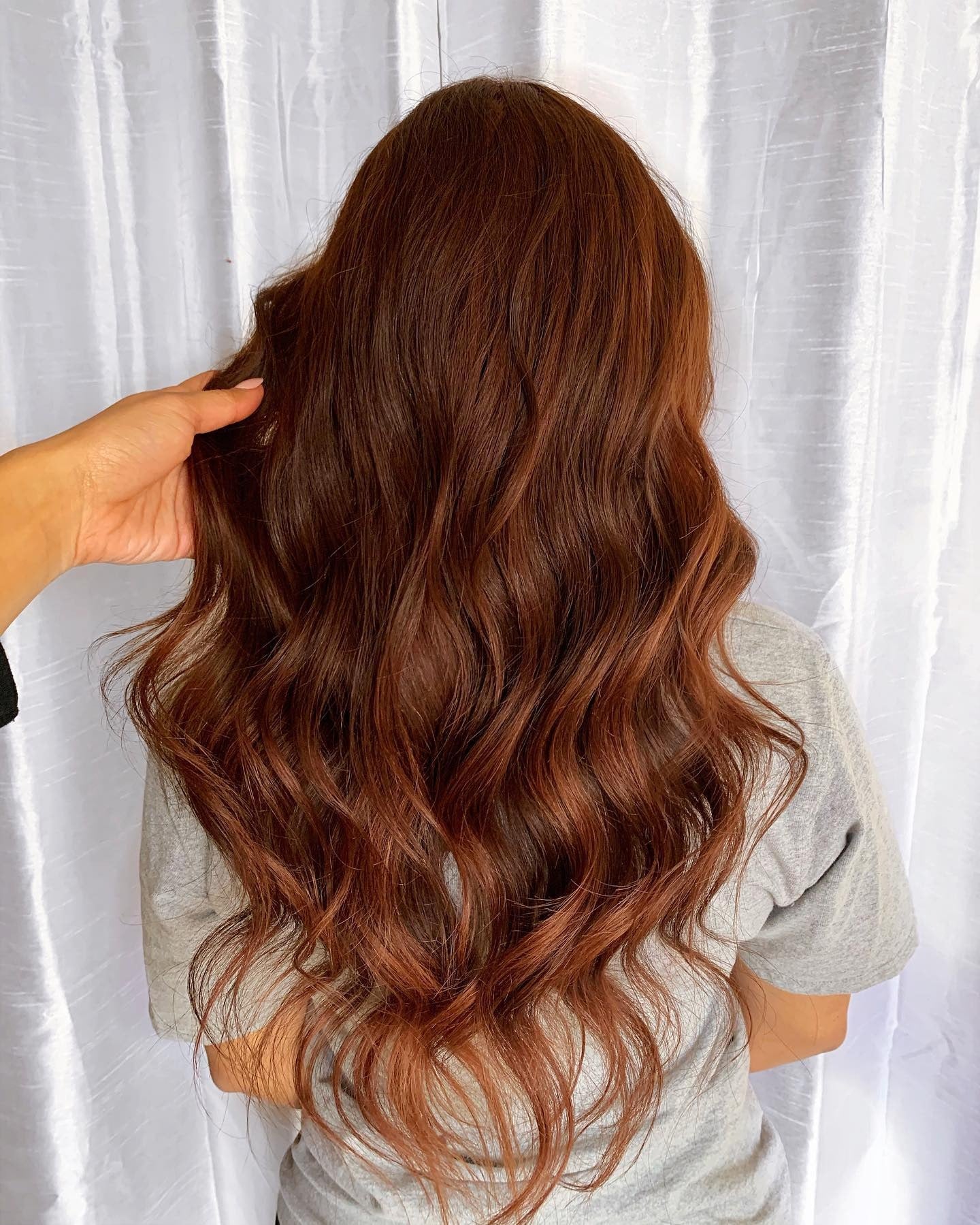 6. Flowing Auburn Layers with Loose Waves (Dark Auburn Hair Color)