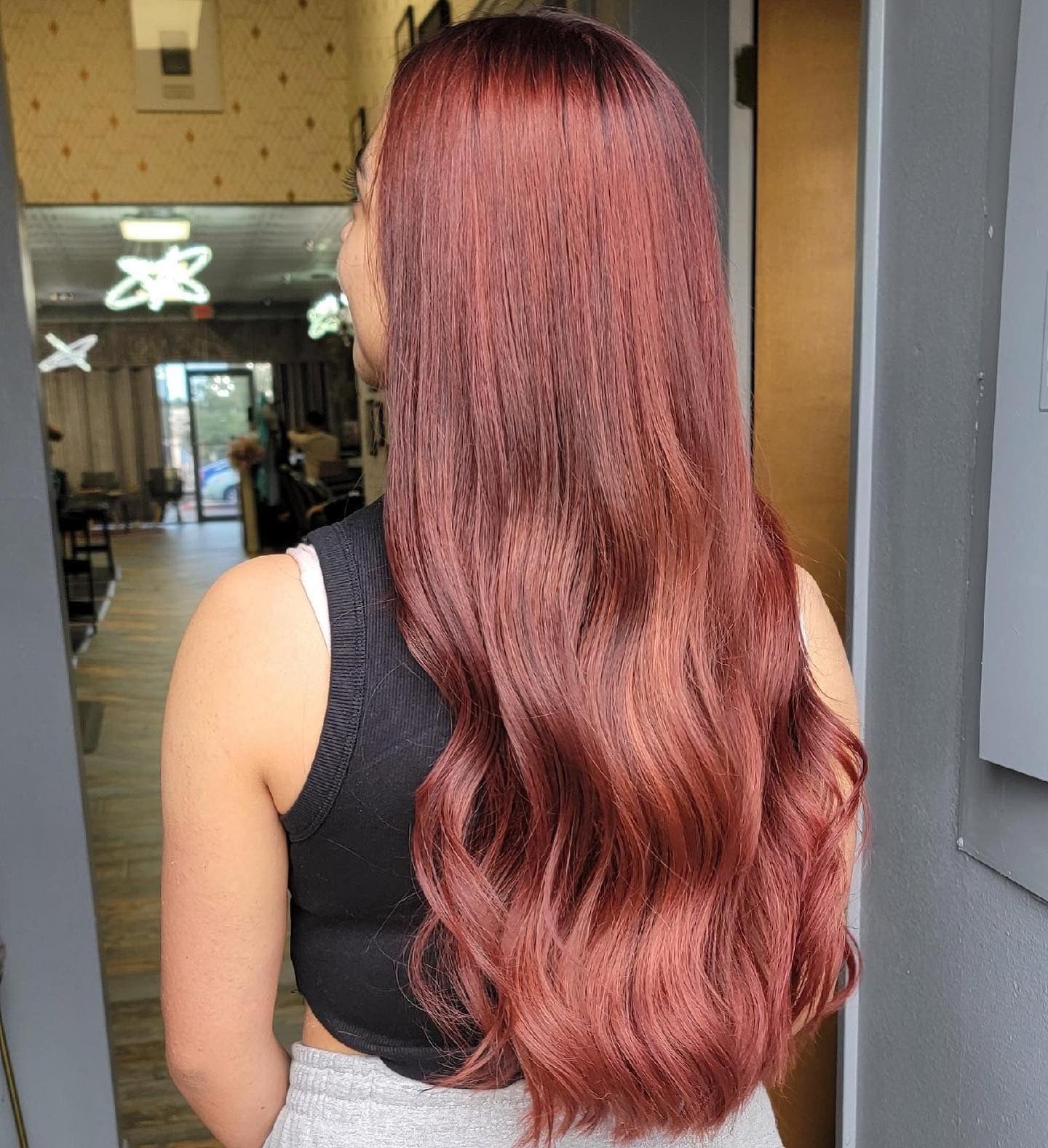 11. Long Auburn Waves with Subtle Shine (Dark Auburn Hair Color)