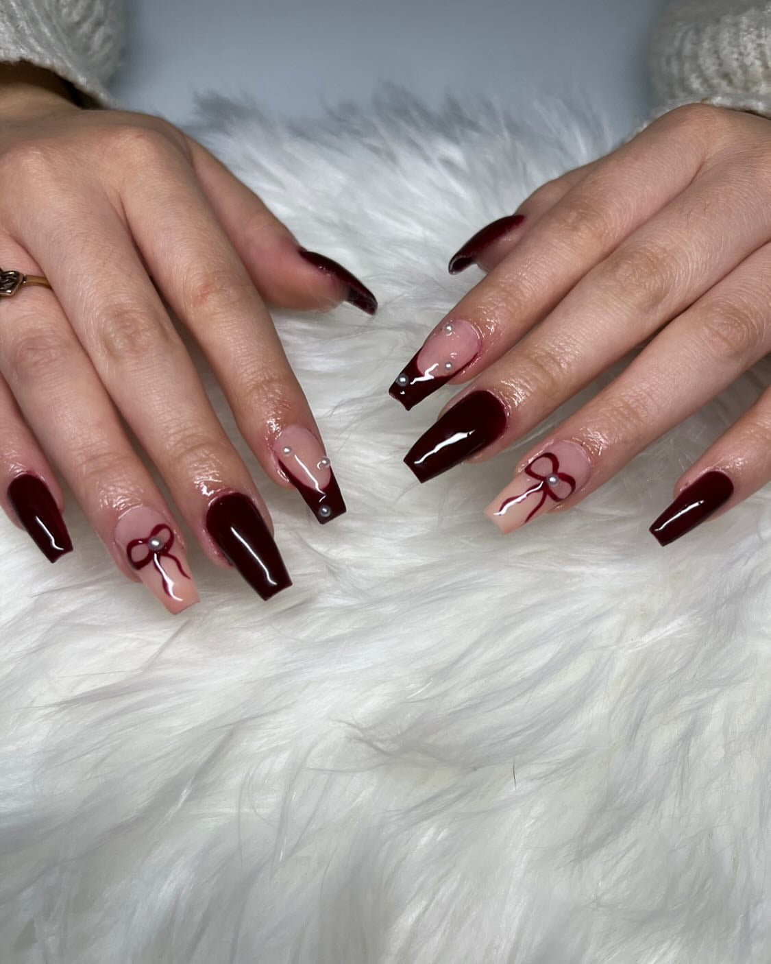 10. Burgundy Coffin Nails with Rhinestone and Bow Accents (Dark Red Coffin Nail Ideas)