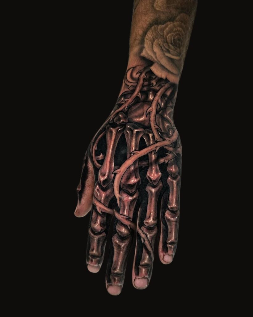 Bones And Thorns Hand Tattoo