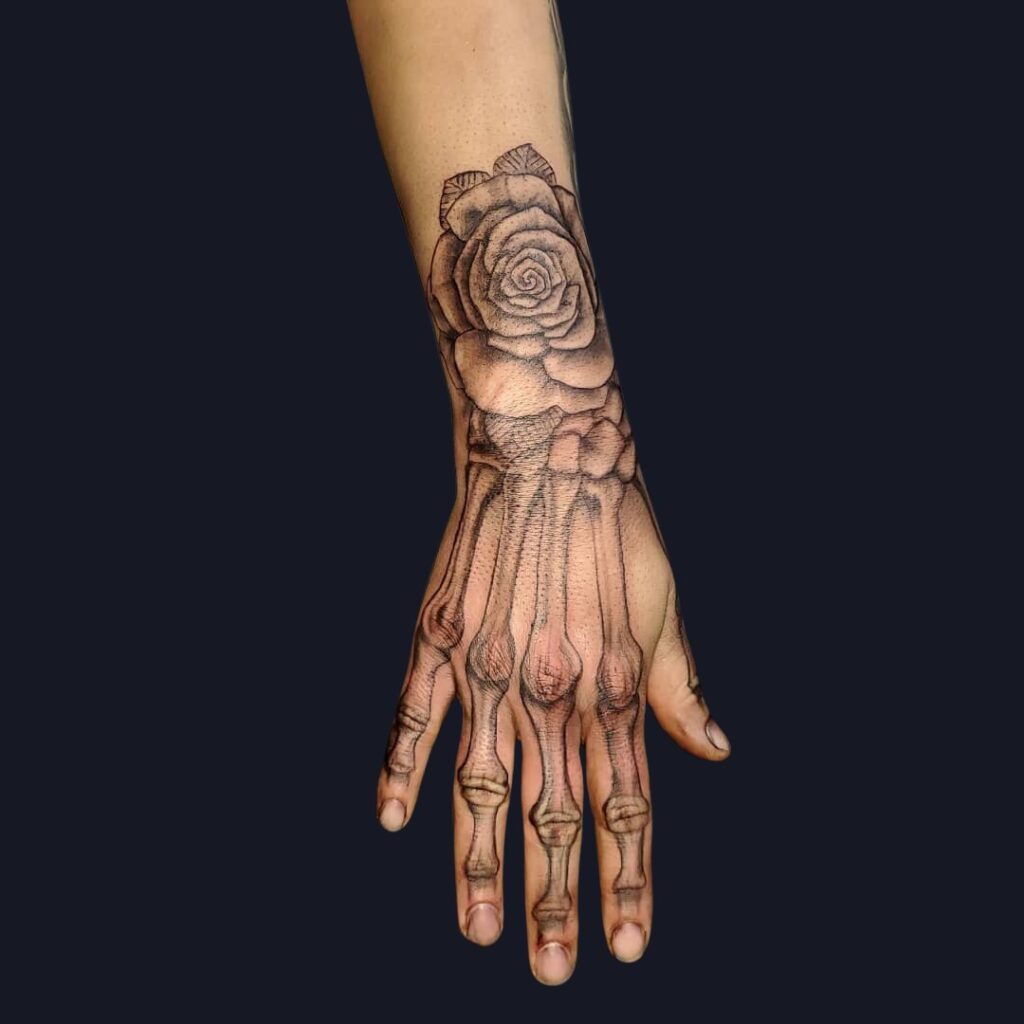 Rose And Bone Hand Tattoo