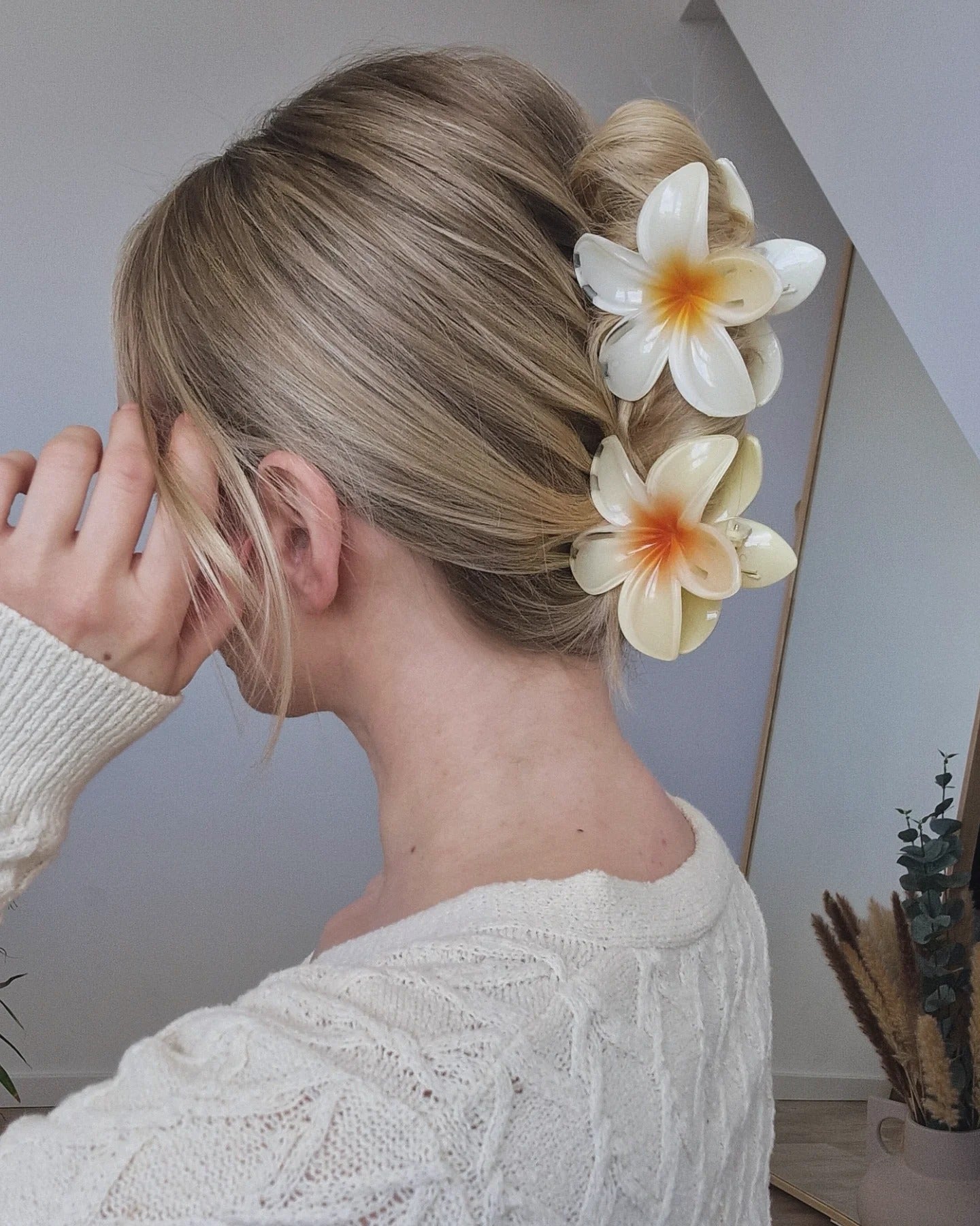 5. Blonde Twisted Updo with Double Floral Clips (Claw Clip Hairstyles)