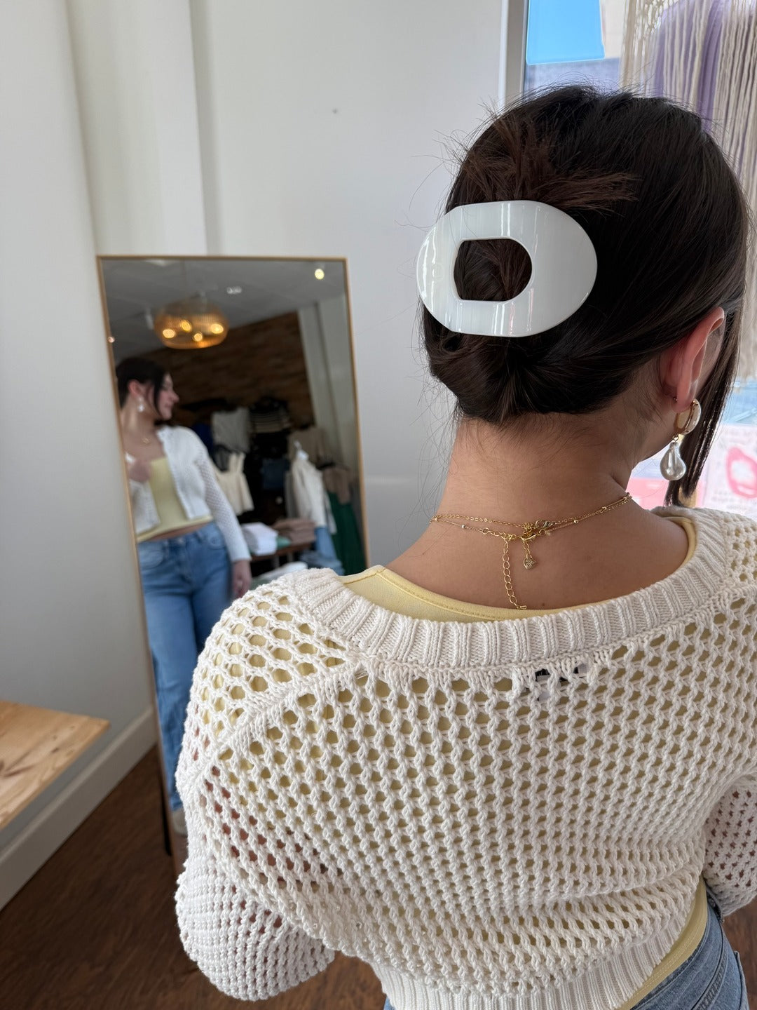 8. Polished Bun with Oversized White Oval Clip (Claw Clip Hairstyles)