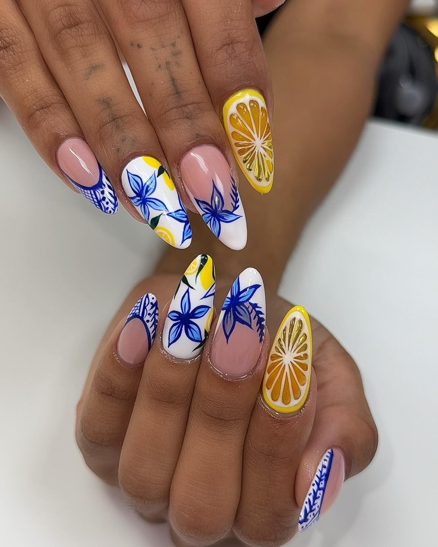 1. Citrus Garden Art on Almond Tips (Yellow and White Nail Ideas)