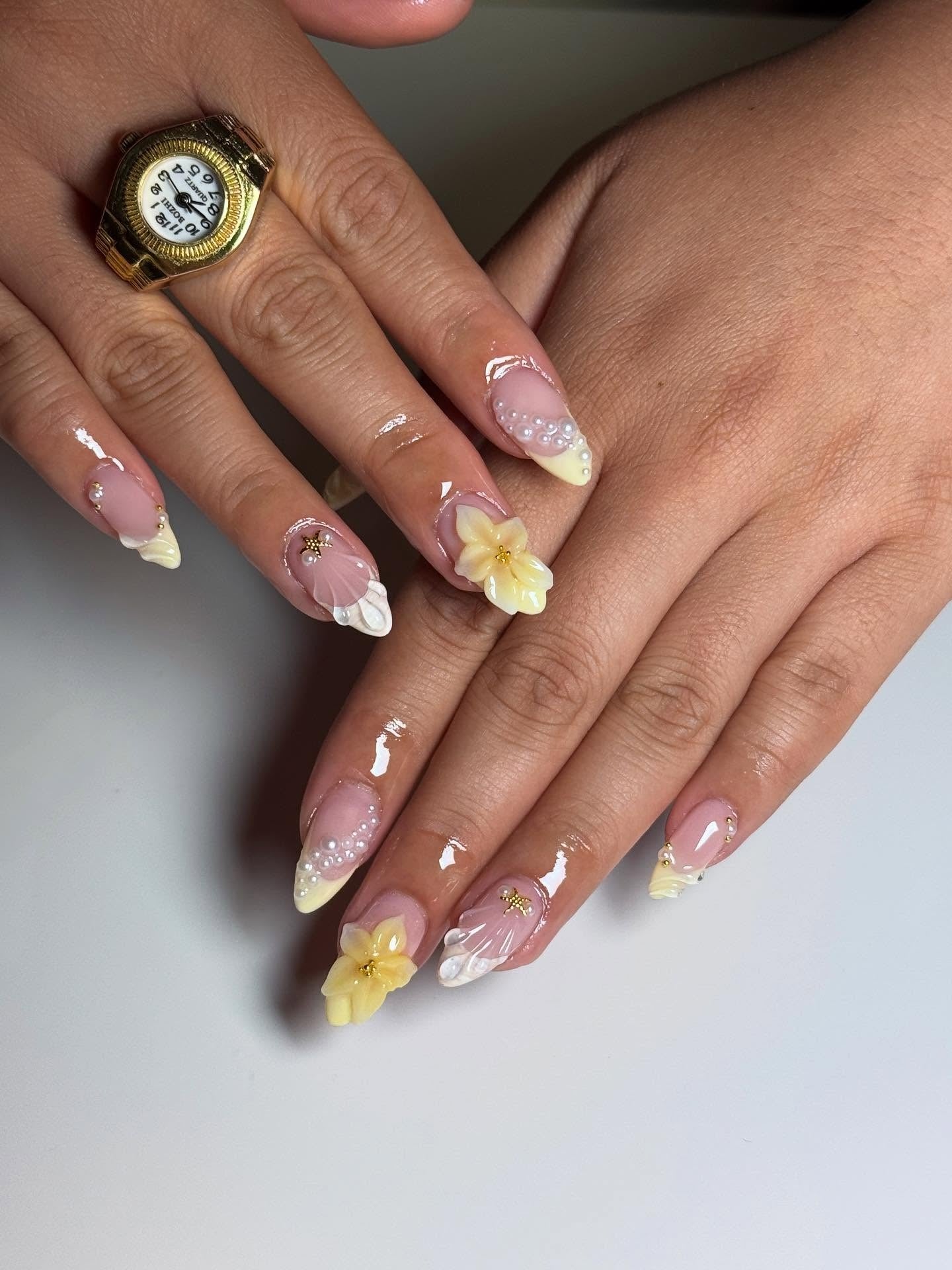 7. Tropical Bloom with Shell & Pearl Details (Yellow and White Nail Ideas)