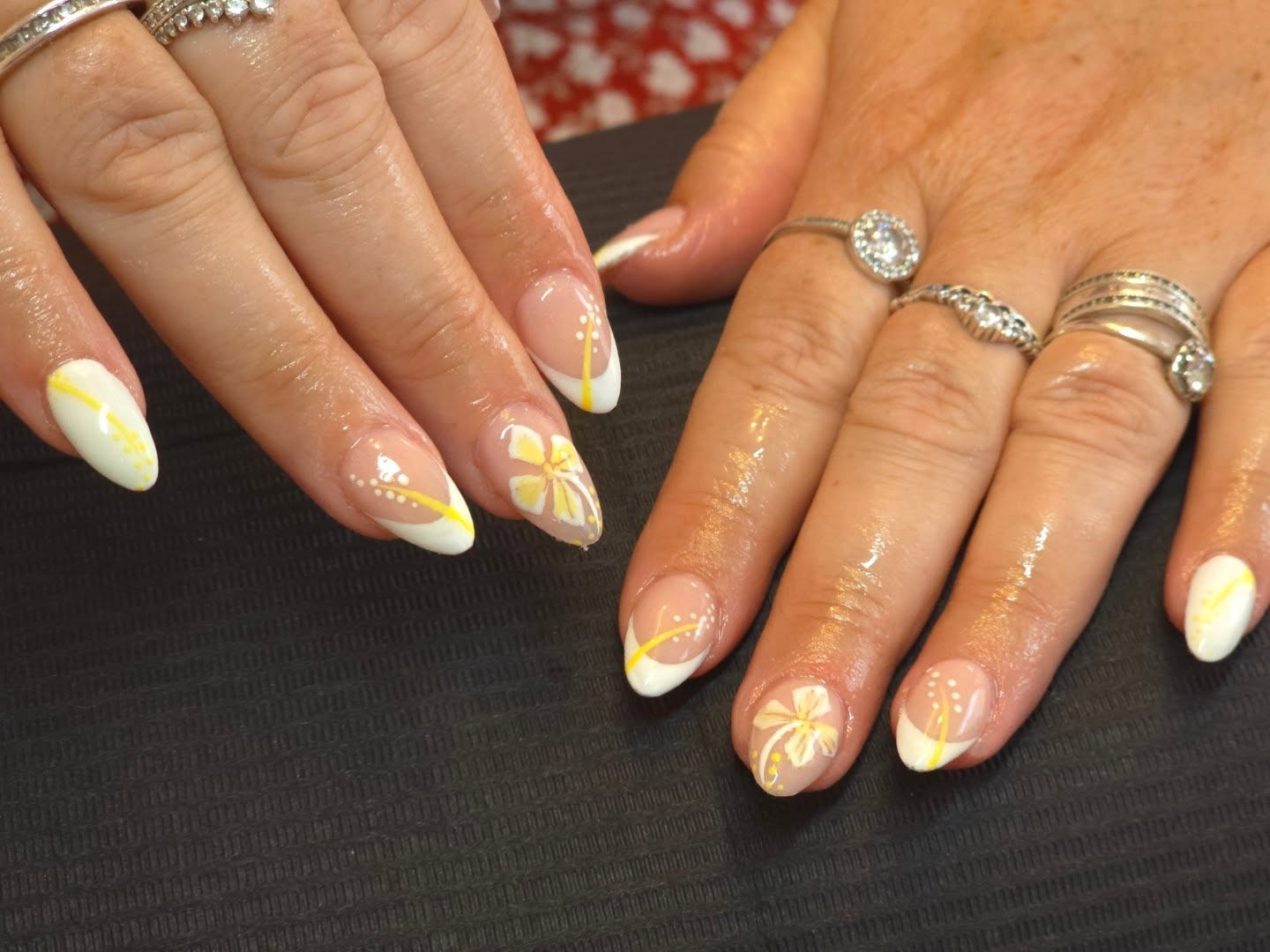9. Butterfly Blossom French with Yellow Accents (Yellow and White Nail Ideas)