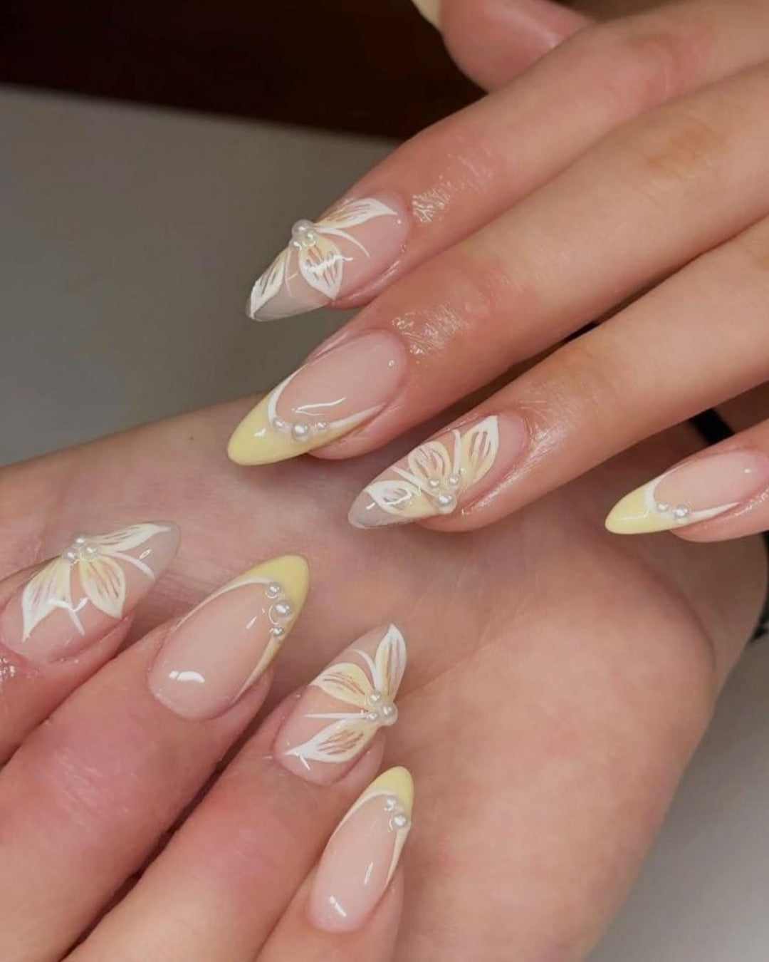 10. Petal Outline and Pearl Cluster Combo (Yellow and White Nail Ideas)