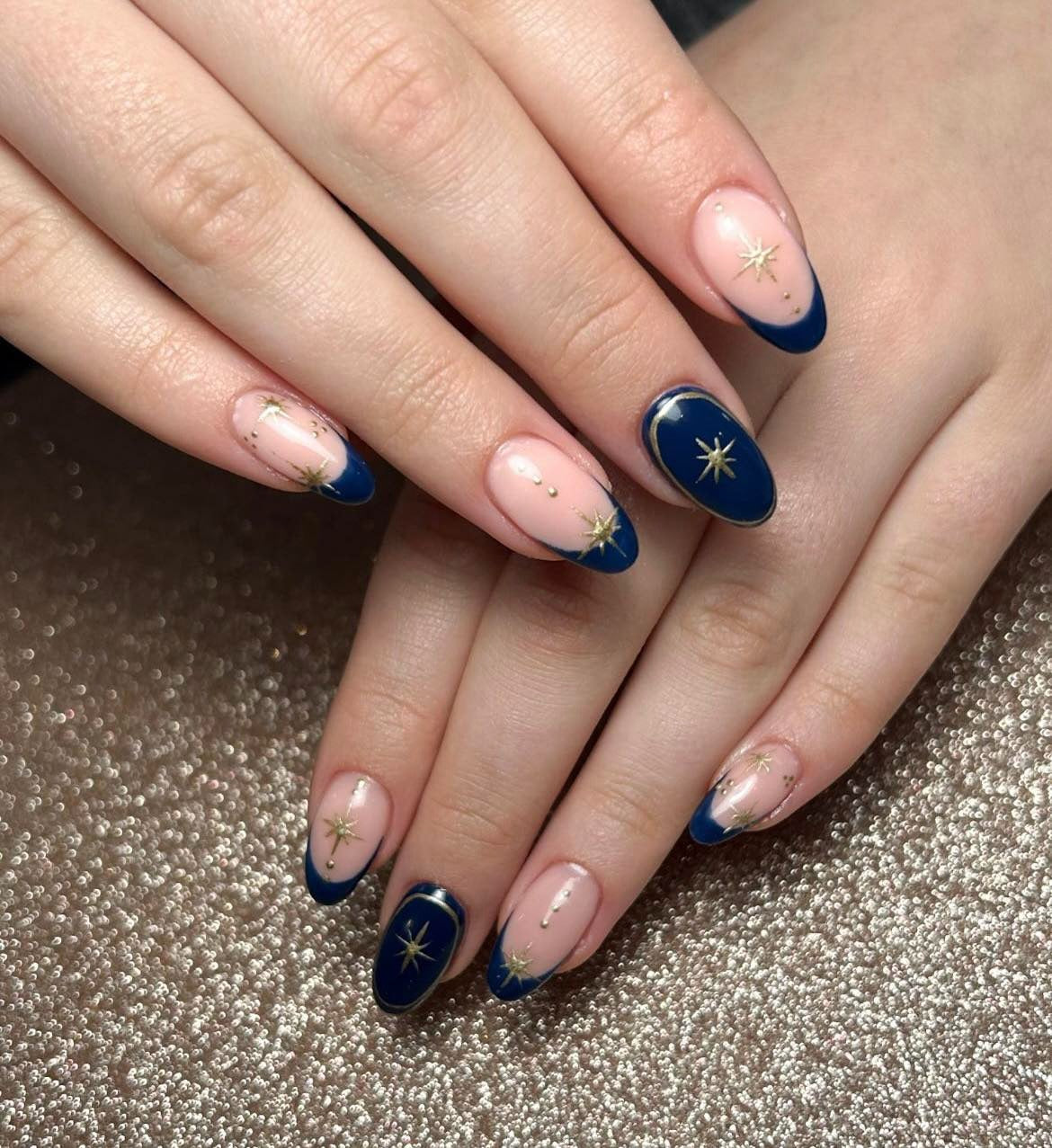 1. Celestial Navy Starburst Nails (Navy and Gold Nail Ideas)