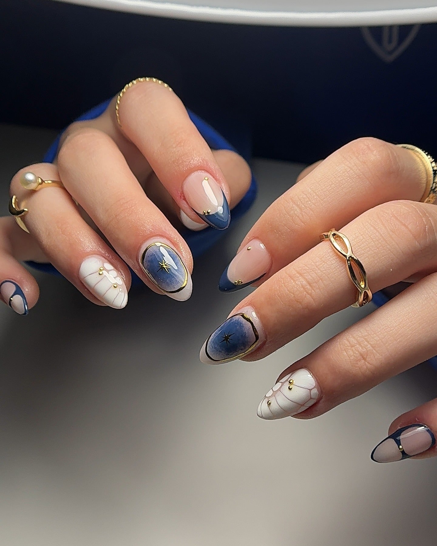 5. Star Map French and Marble Mix (Navy and Gold Nail Ideas)