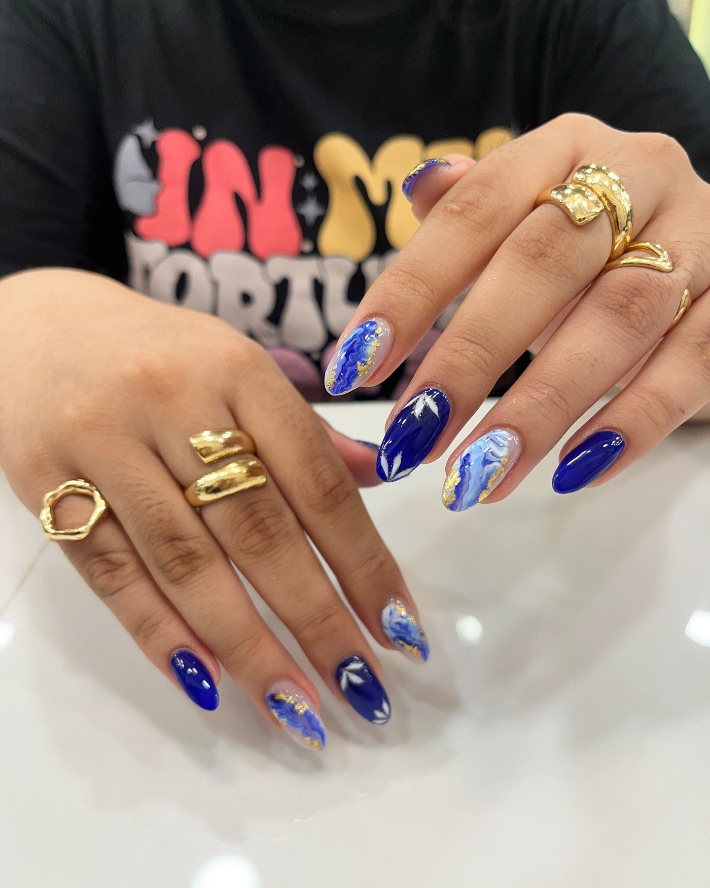 6. Ocean Marble and Navy Gold Nails (Navy and Gold Nail Ideas)