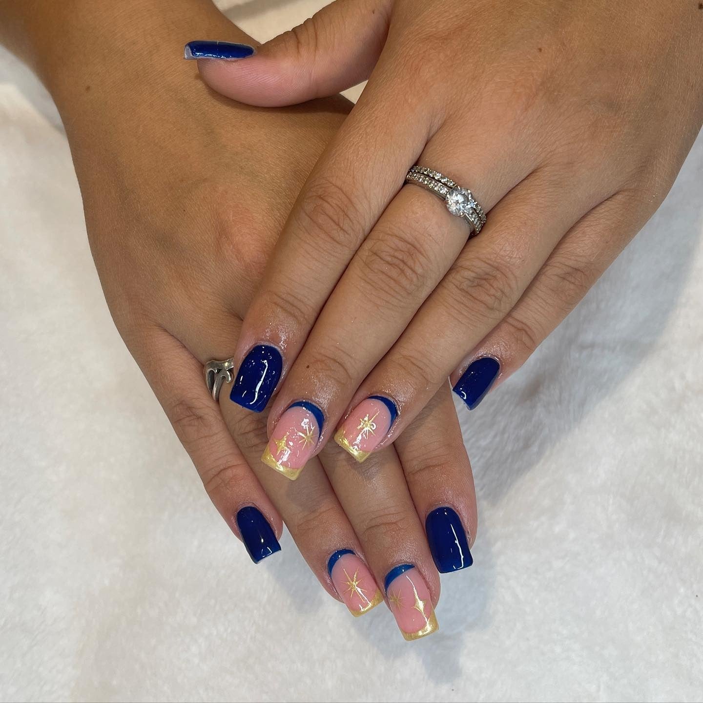 7. Golden Star French Tips (Navy and Gold Nail Ideas)