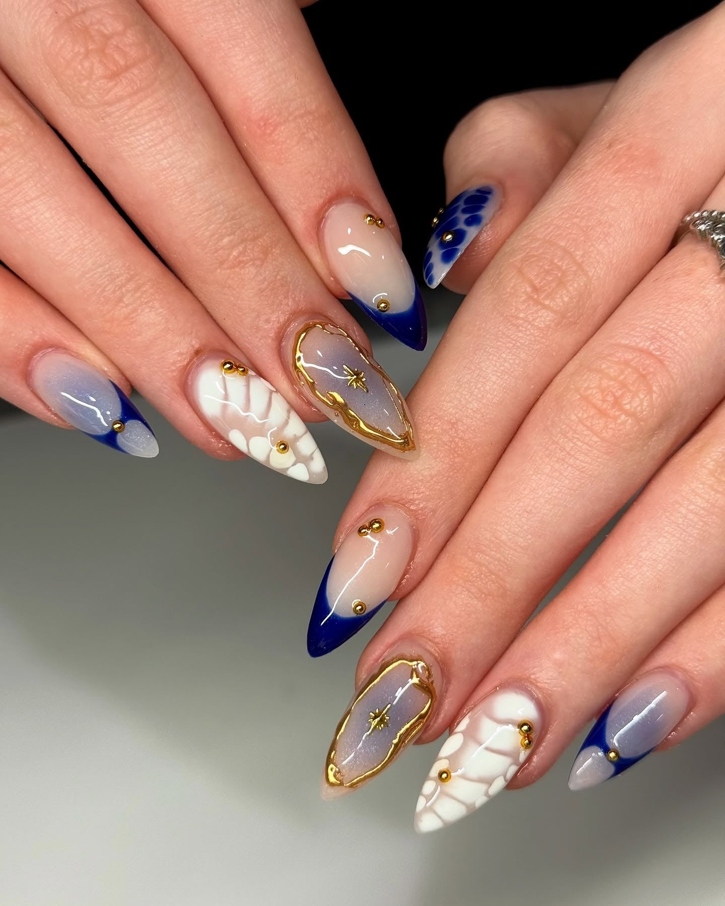 13. Galaxy Bloom and French Mix Nails (Navy and Gold Nail Ideas)