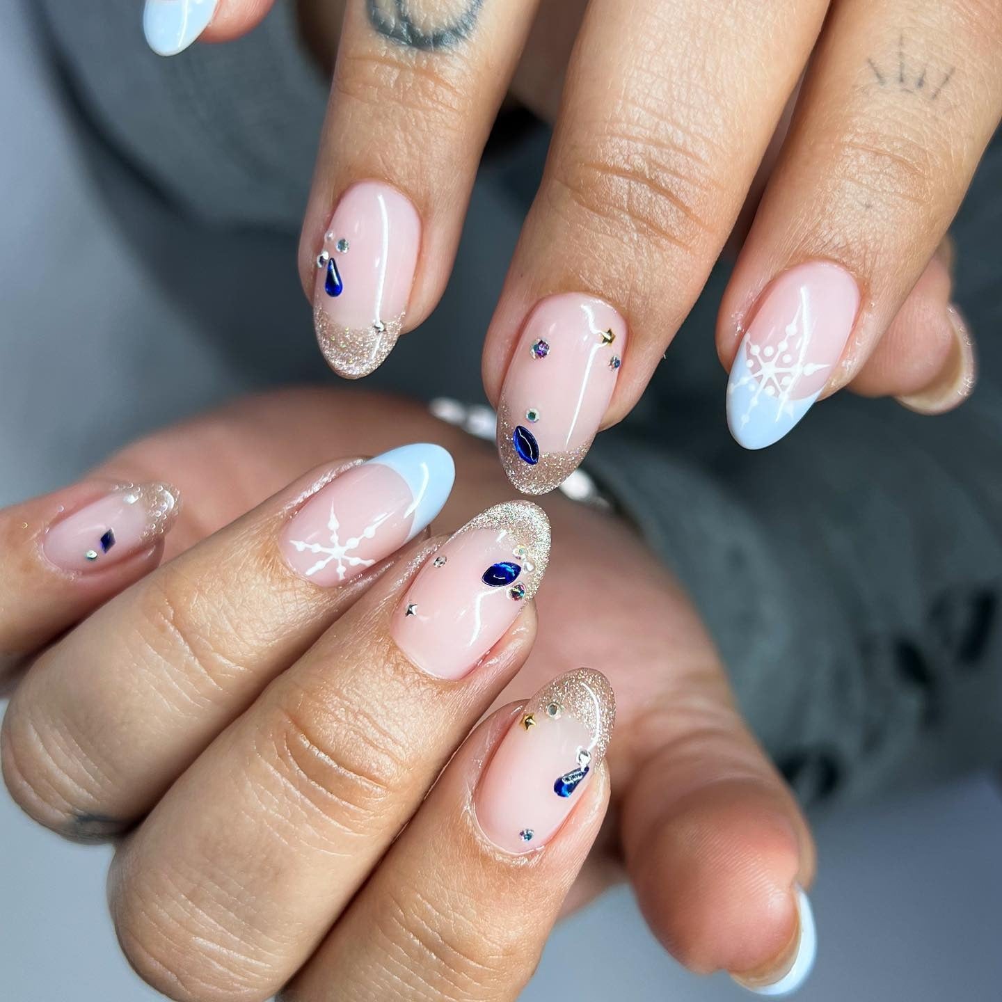 2. Icy Blue Tips with Golden Sparkle and Gems (Winter Birthday Nail Ideas)