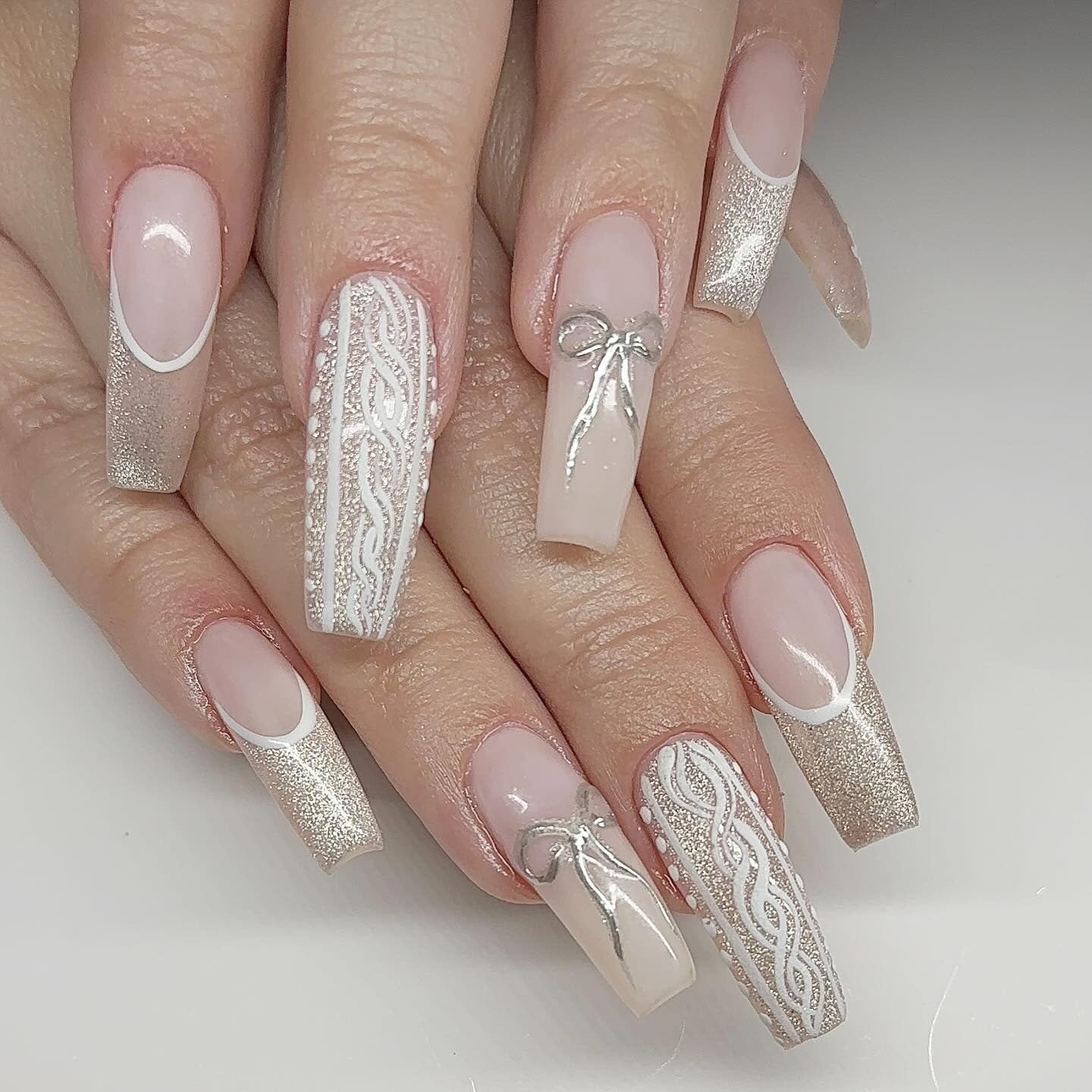 7. Champagne Knits and Silver Bows (Winter Birthday Nail Ideas)