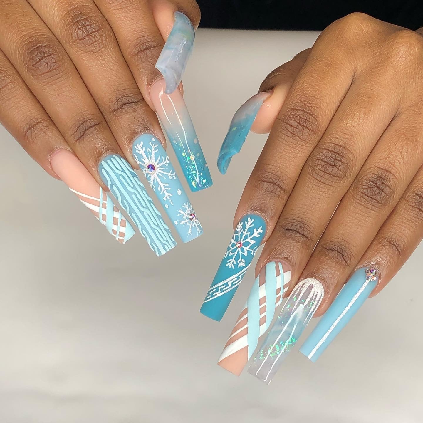 10. Frozen Blue Snowflake Art with Abstract Lines (Winter Birthday Nail Ideas)