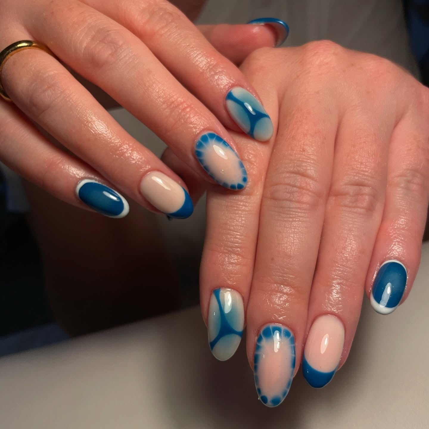 12. Electric Blue Gloss with Frosty Abstract Tips (Winter Birthday Nail Ideas)
