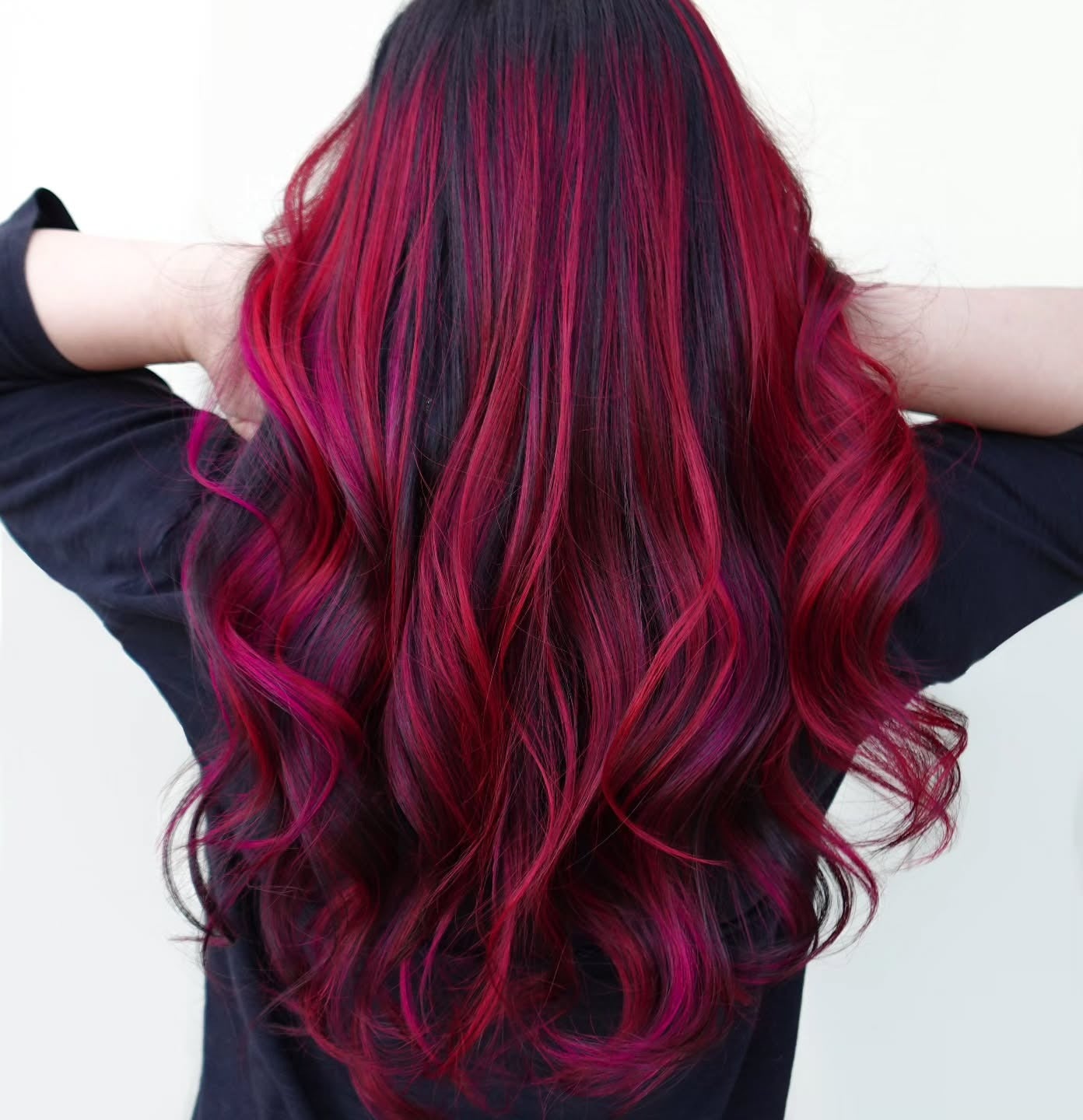 7. Black and Magenta Waves with Dimensional Balayage (Red Hair with Highlights)
