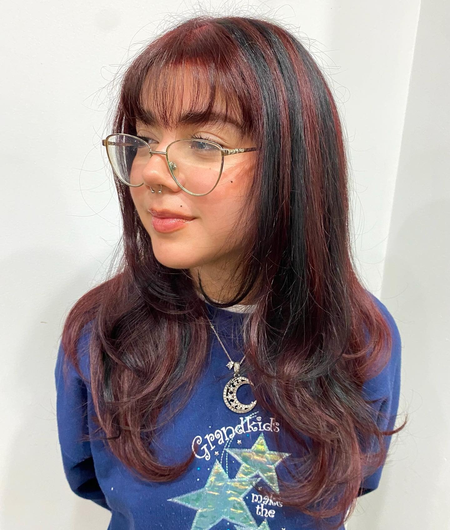 13. Black Cherry and Burgundy Blend with Micro Bangs (Red Hair with Highlights)