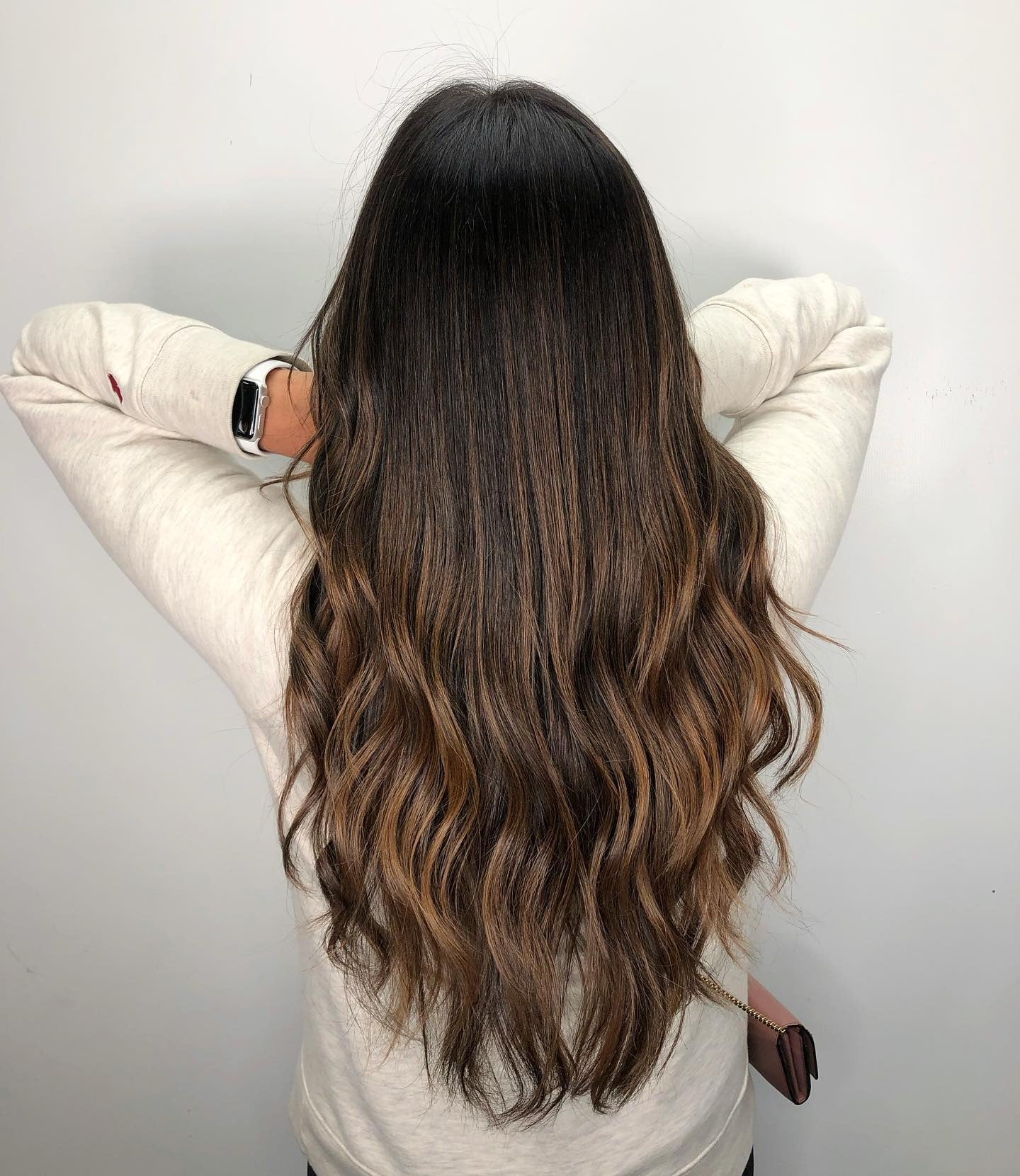 4. Dimensional Long Waves with Bronze Highlights (Medium Brown Hair Color)