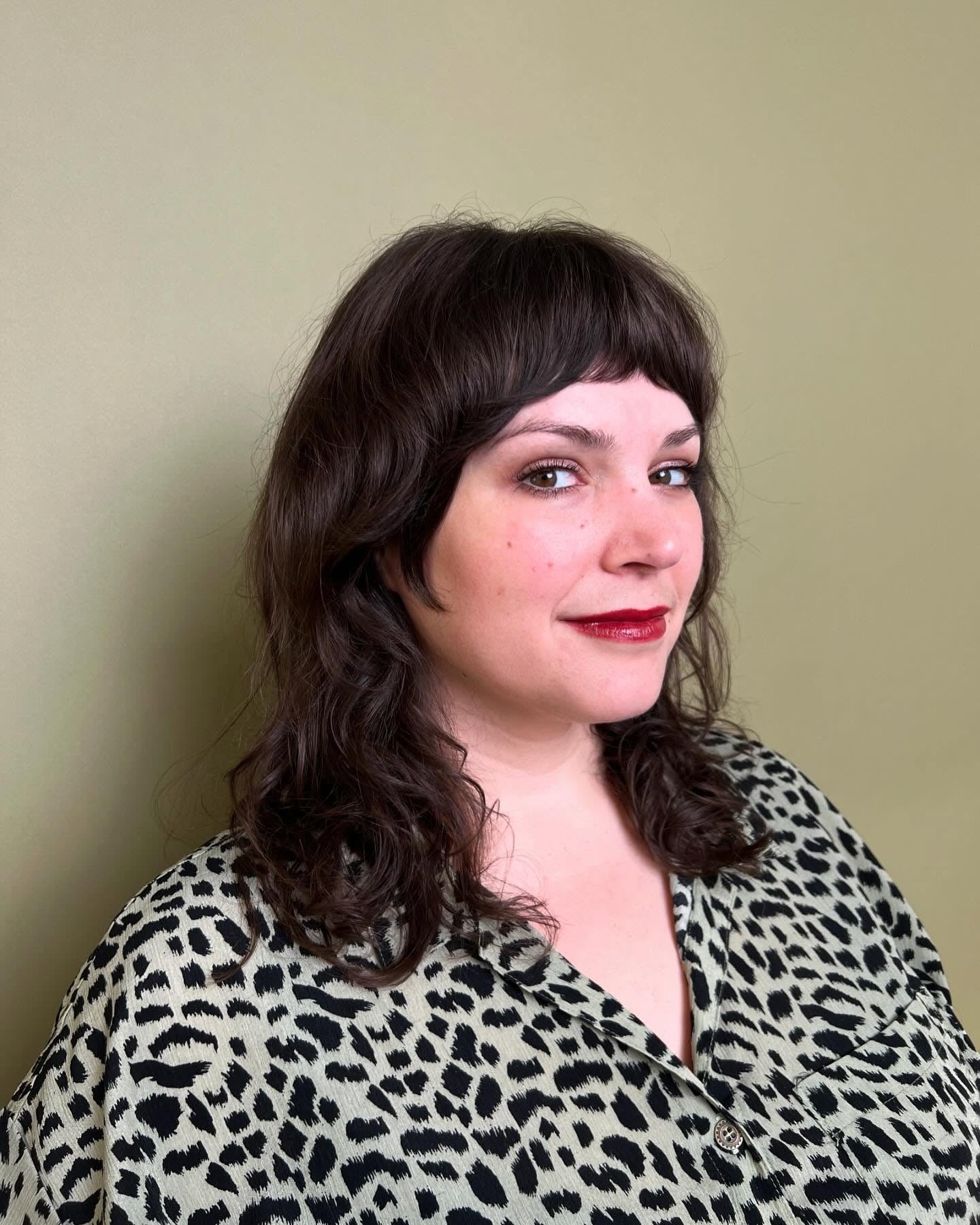 9. Wavy Mid-Length Shag with Micro Bangs (70S Hairstyles)