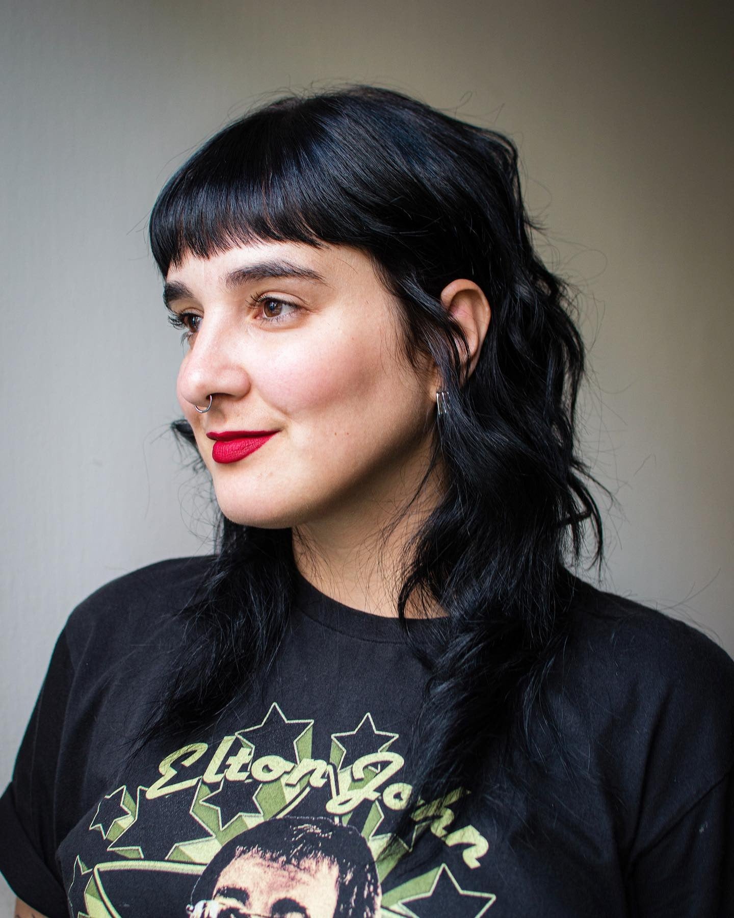 10. Sleek Black Shag with Baby Bangs (70S Hairstyles)