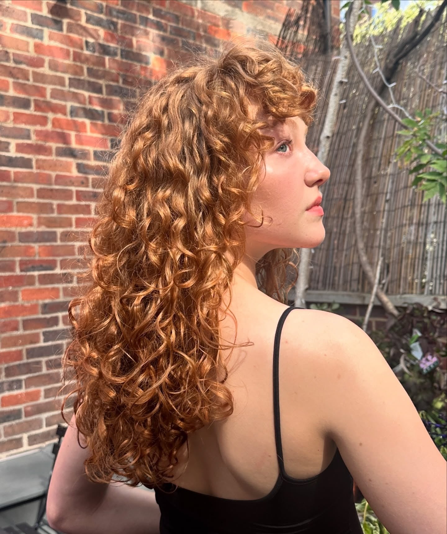 5. Copper Curly Perm with Soft Bangs (Perm Hairstyles)