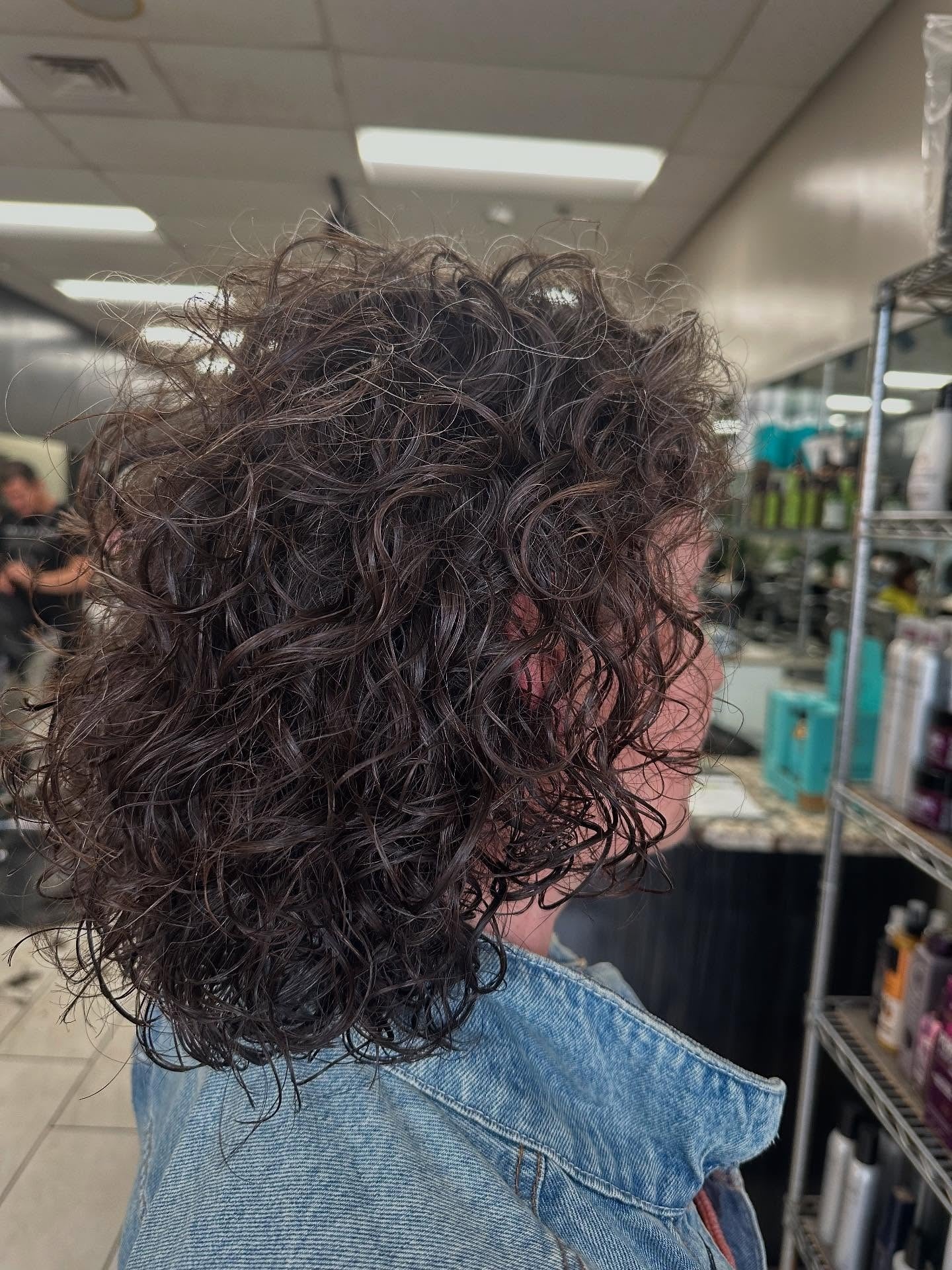 10. Tousled Dark Perm with Casual Layers (Perm Hairstyles)