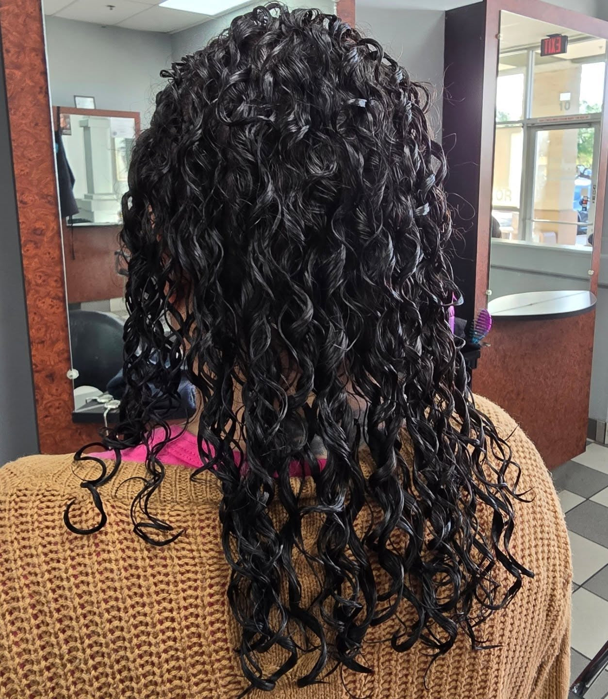 13. Glossy Black Long Perm with Defined Spirals (Perm Hairstyles)