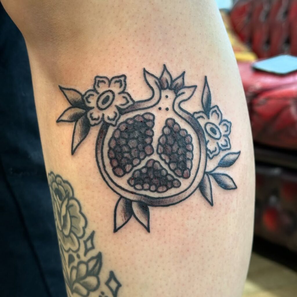 Traditional Black And Grey Pomegranate Tattoo
