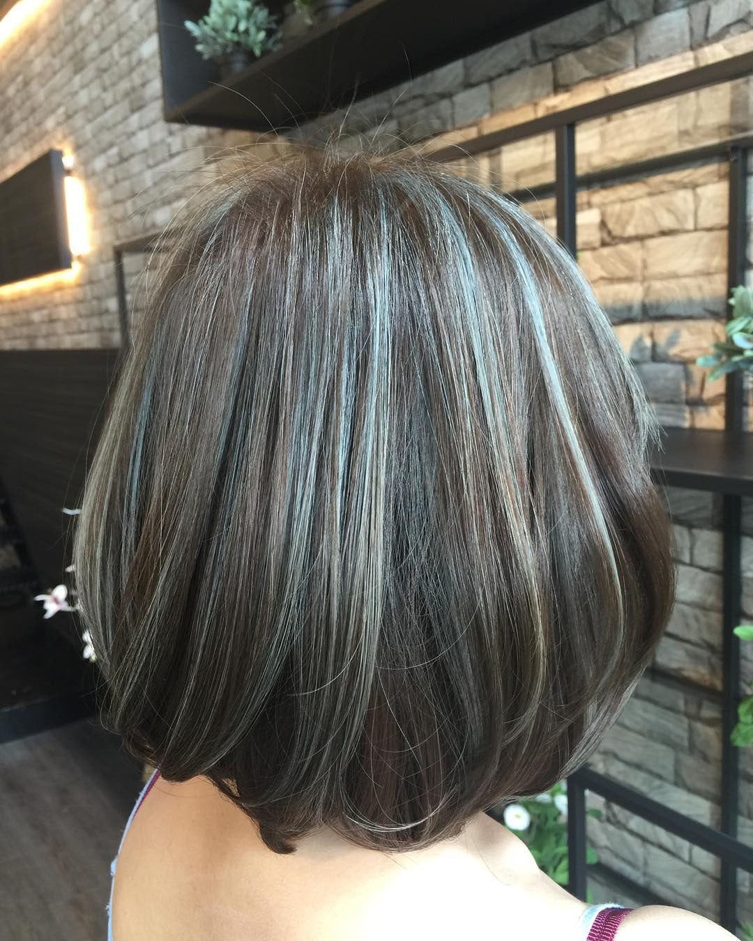4. Dimensional Bob with Silver-Ash Highlights (Dark Ash Brown Hair Color)