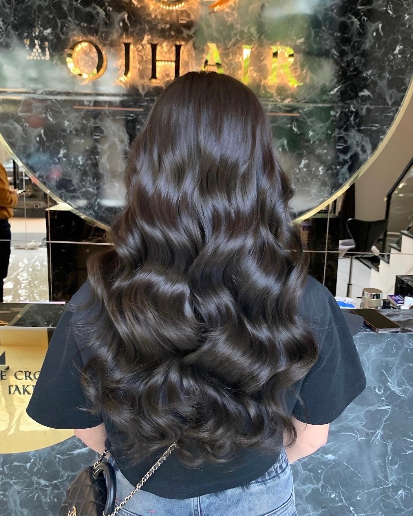 10. Glossy Hollywood Waves in Deep Ash (Dark Ash Brown Hair Color)