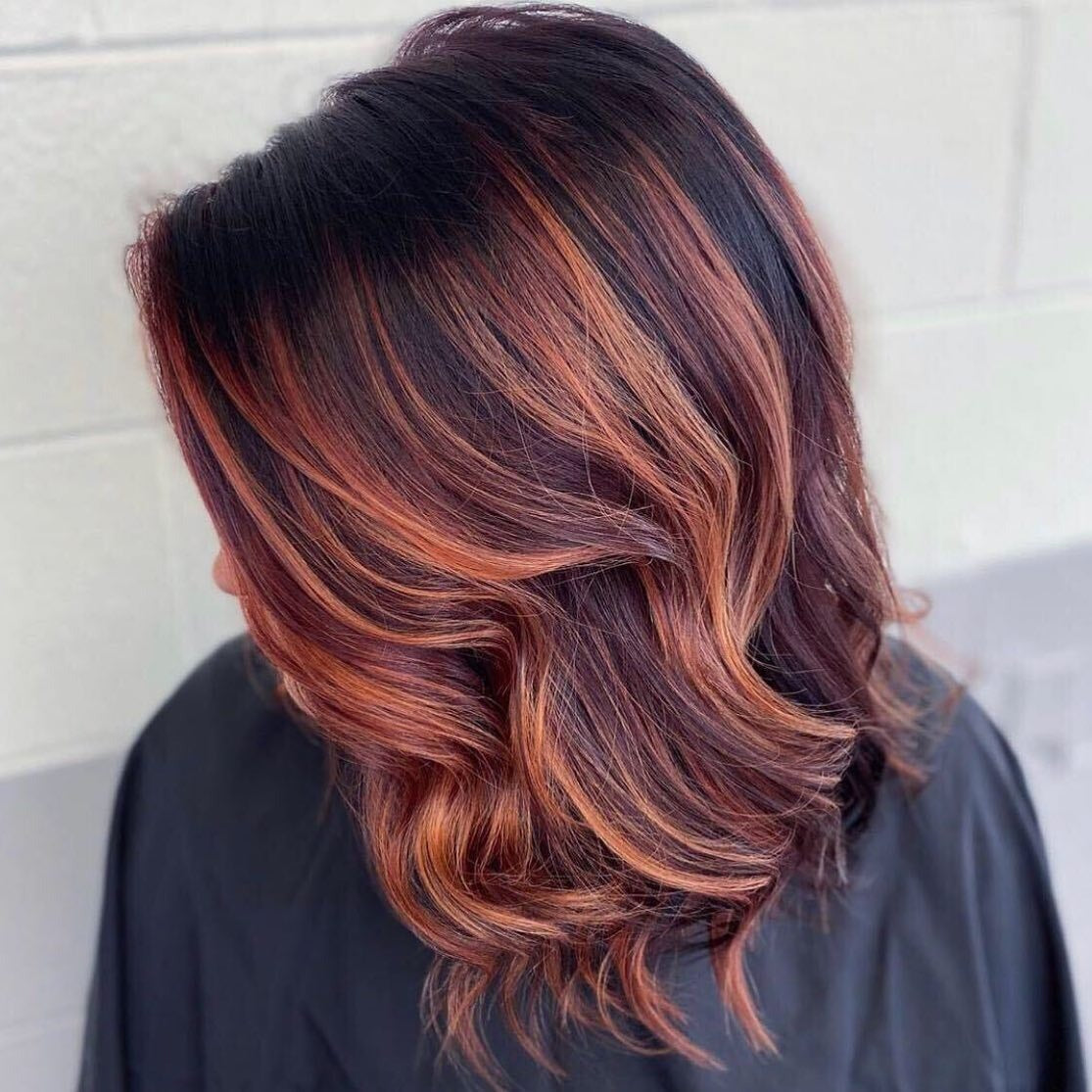 8. Dark Cherry Blend with Fiery Tangerine Strips (Red Brown Hair with Highlights)
