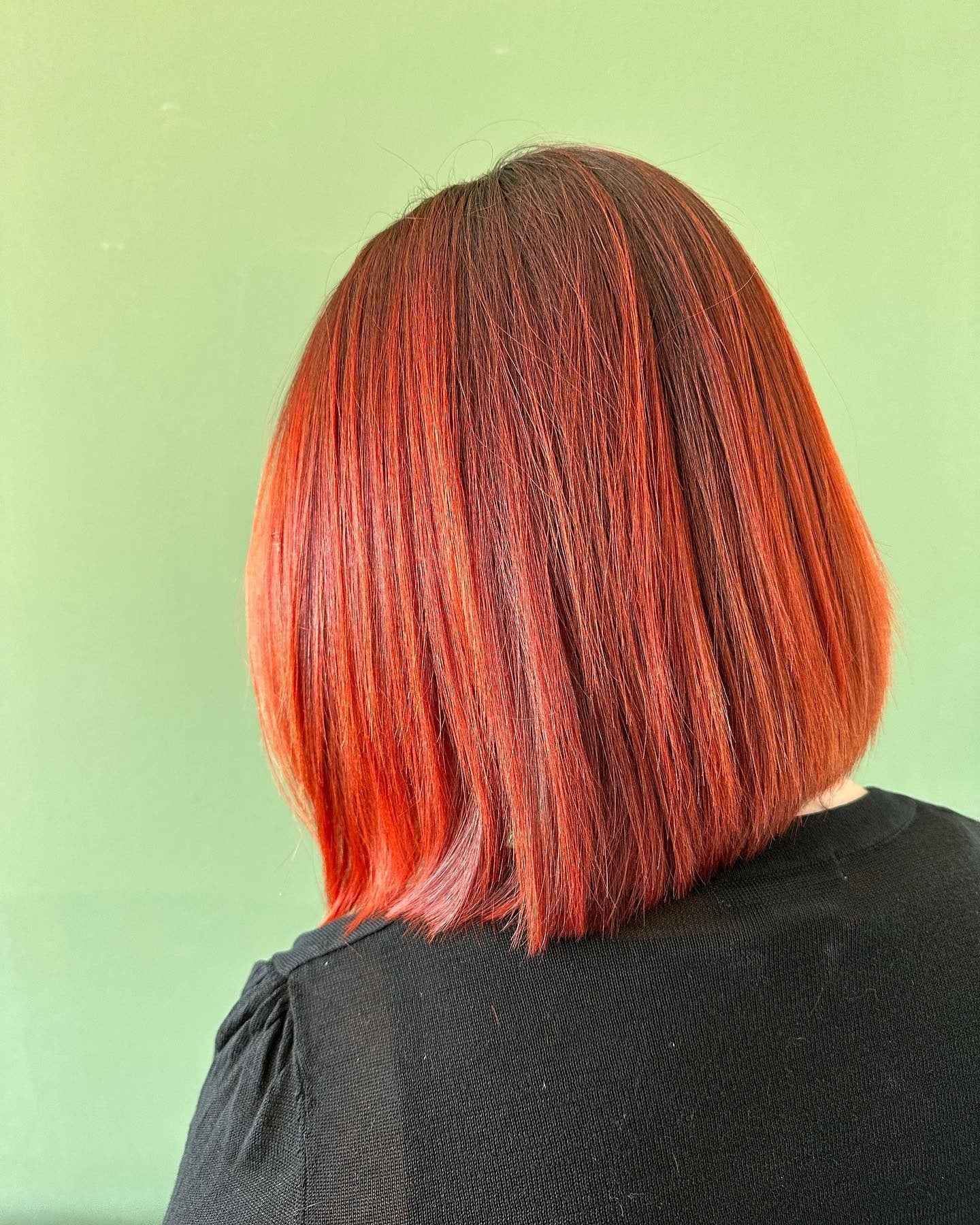 9. Smooth Scarlet Bob (Red Orange Hair Color)
