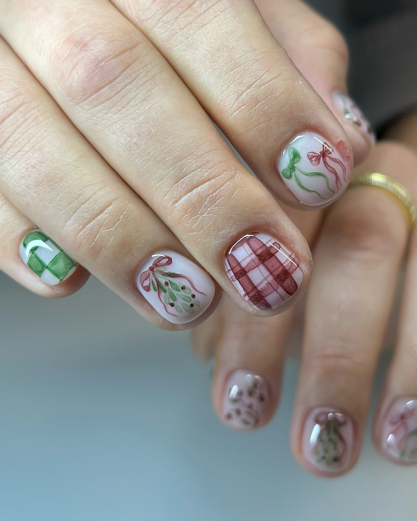3. Winter Bows and Berry Accents (Short Winter Nail Ideas)