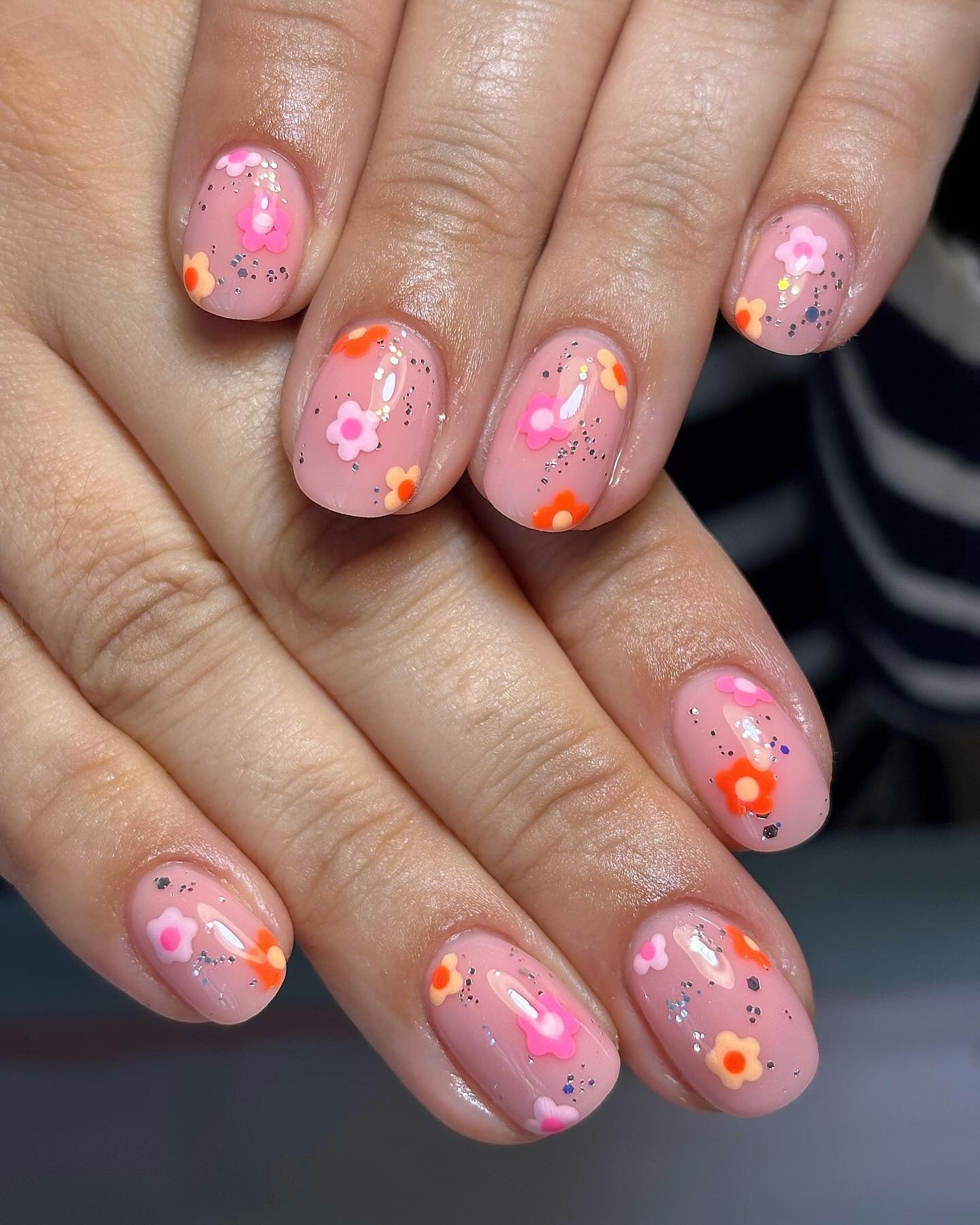 9. Bright Floral Confetti with Silver Sparkle (Short Winter Nail Ideas)