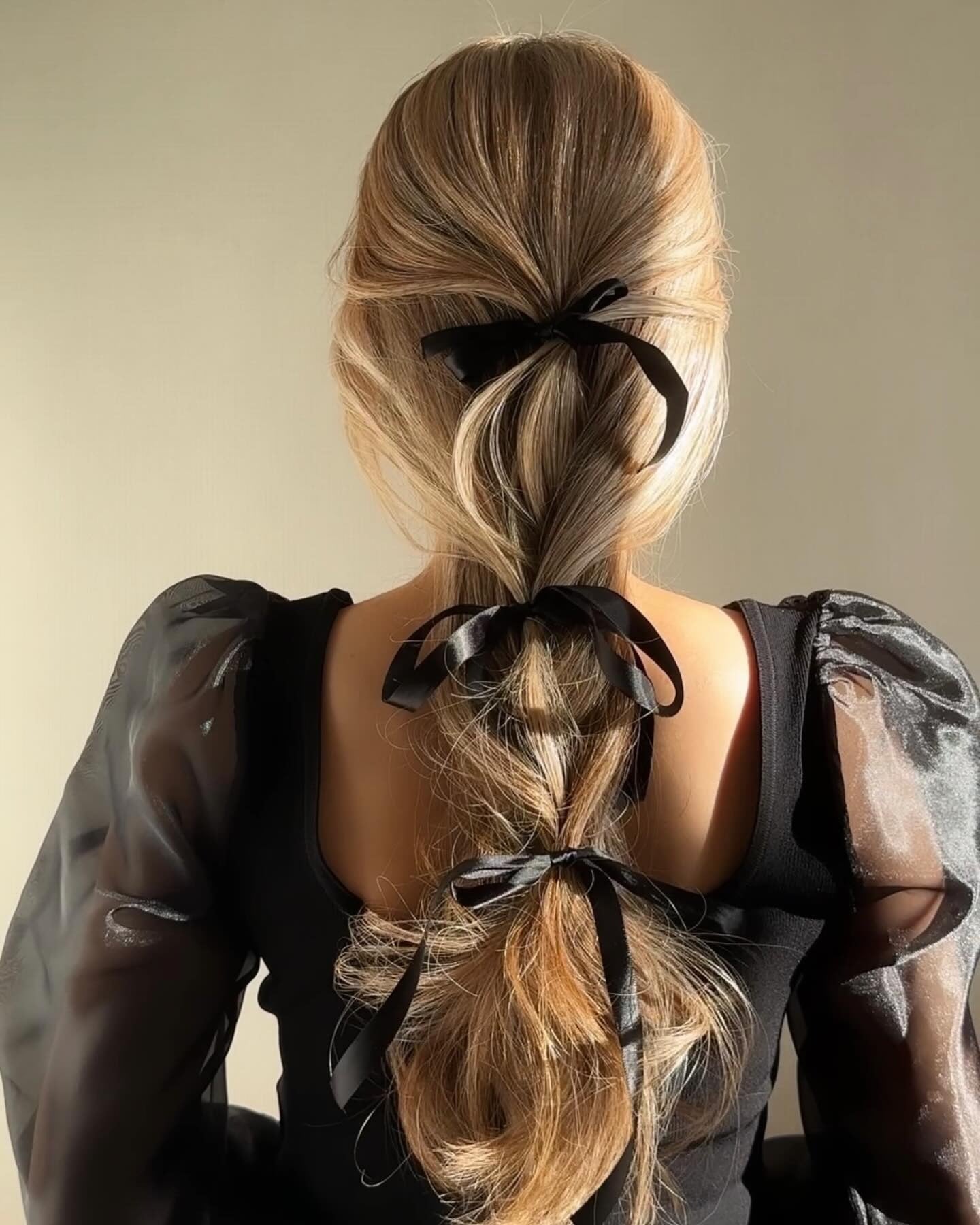 8. Ribbon-Wrapped Looped Ponytail in Beige Blonde (Winter Hairstyles)