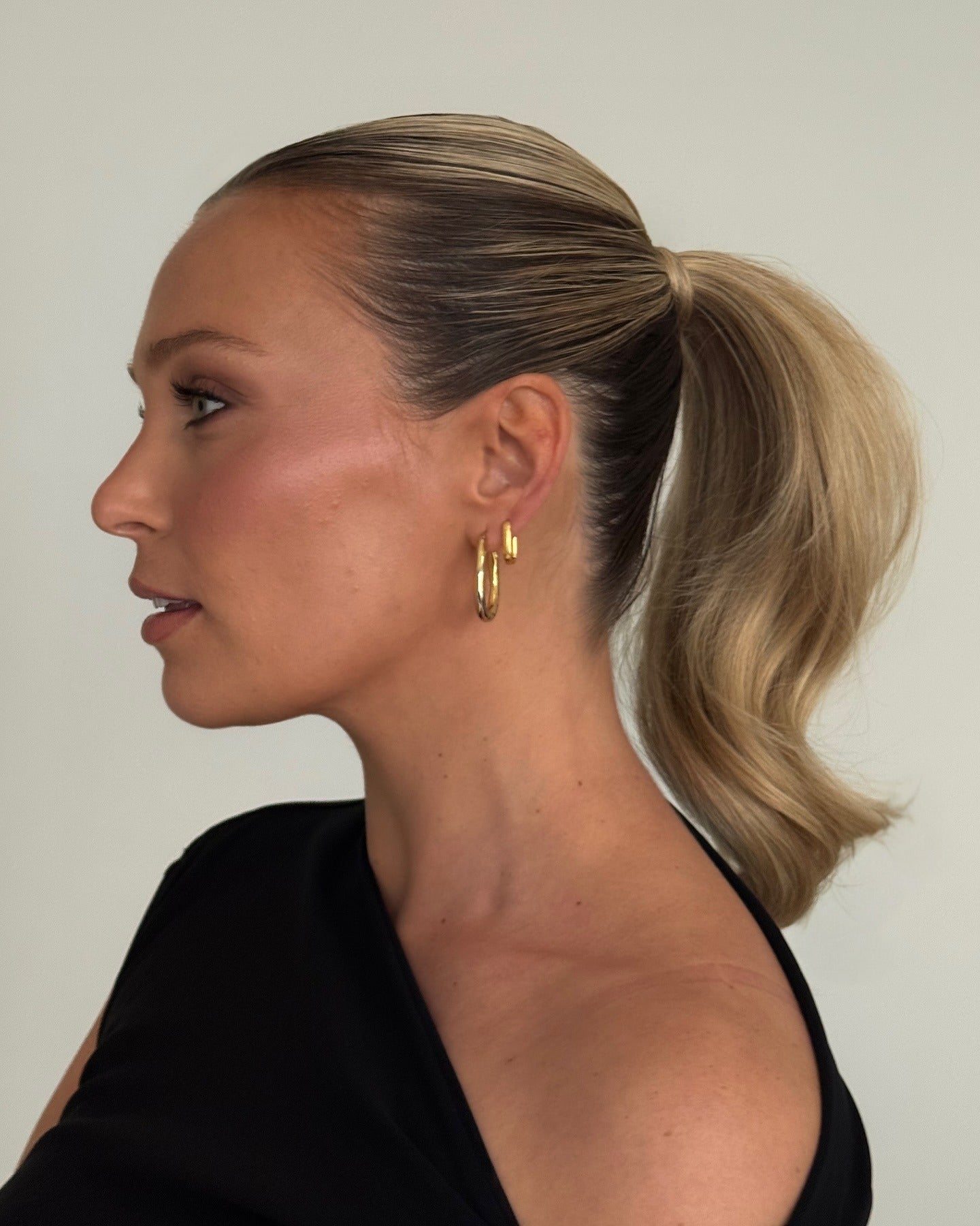 3. High Ponytail with Ash Blonde Dimension (Slick Back Hairstyles)