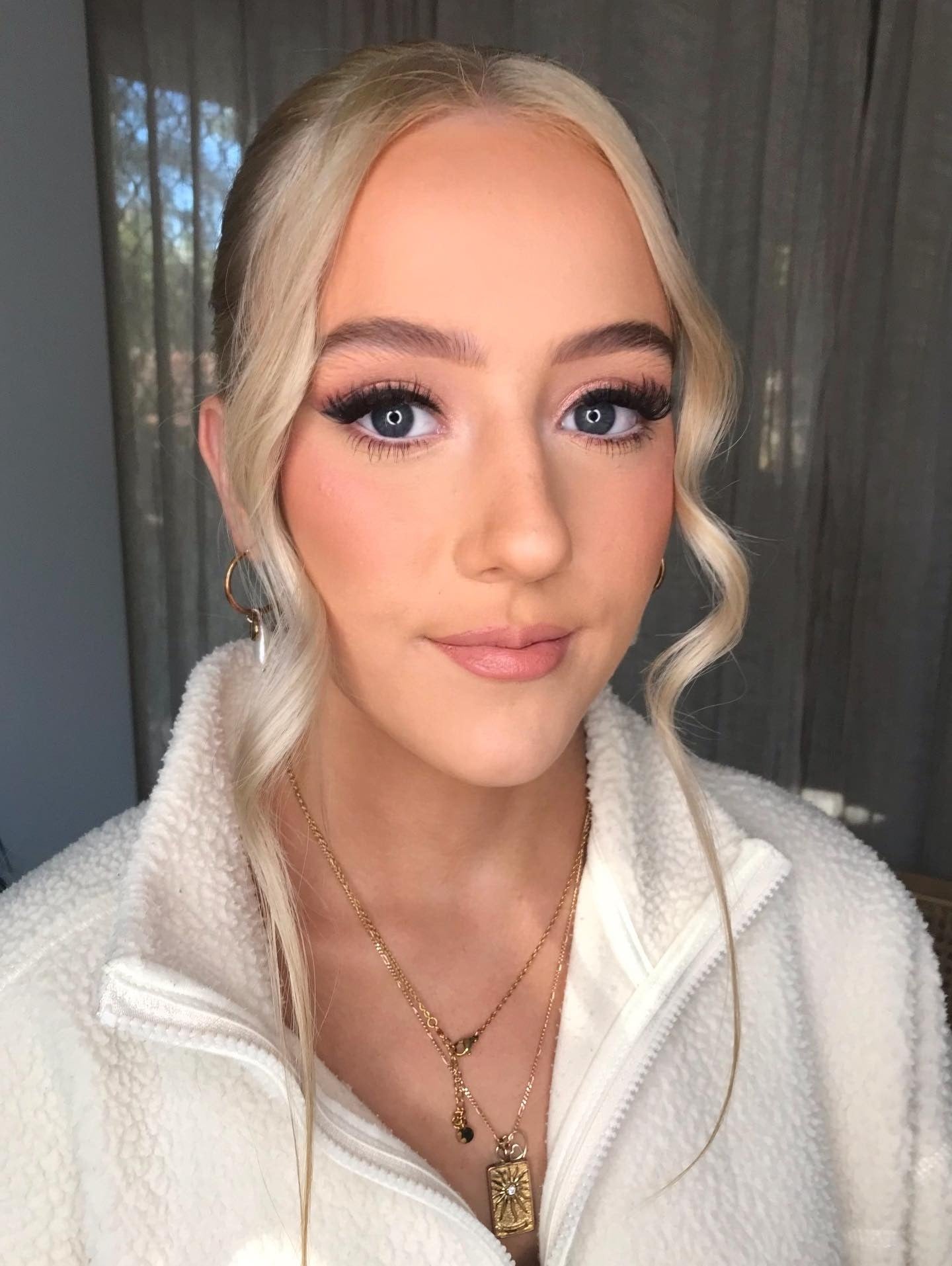 13. Sleek Updo with Platinum Blonde Face Frames (Slick Back Hairstyles)