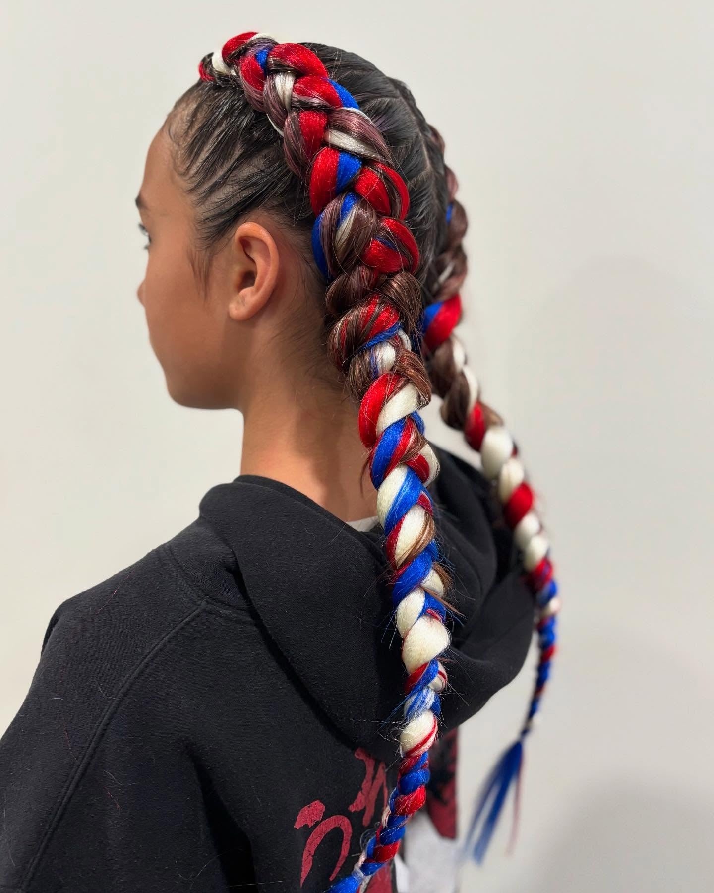 4. Patriotic Braided Pigtails with Red, White, and Blue Extensions (Softball Hairstyles)