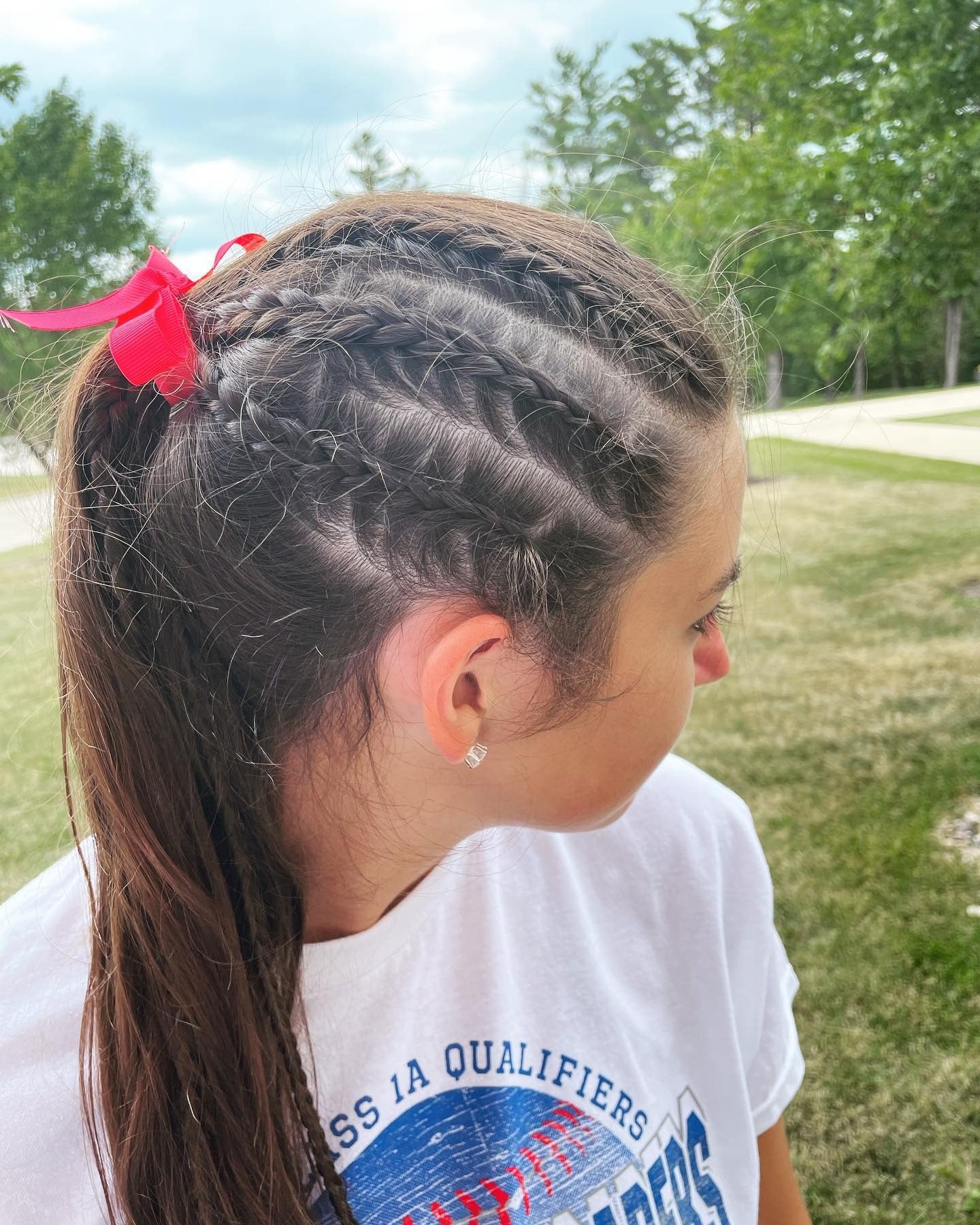 9. Side Cornrows into Ponytail with Red Ribbon (Softball Hairstyles)